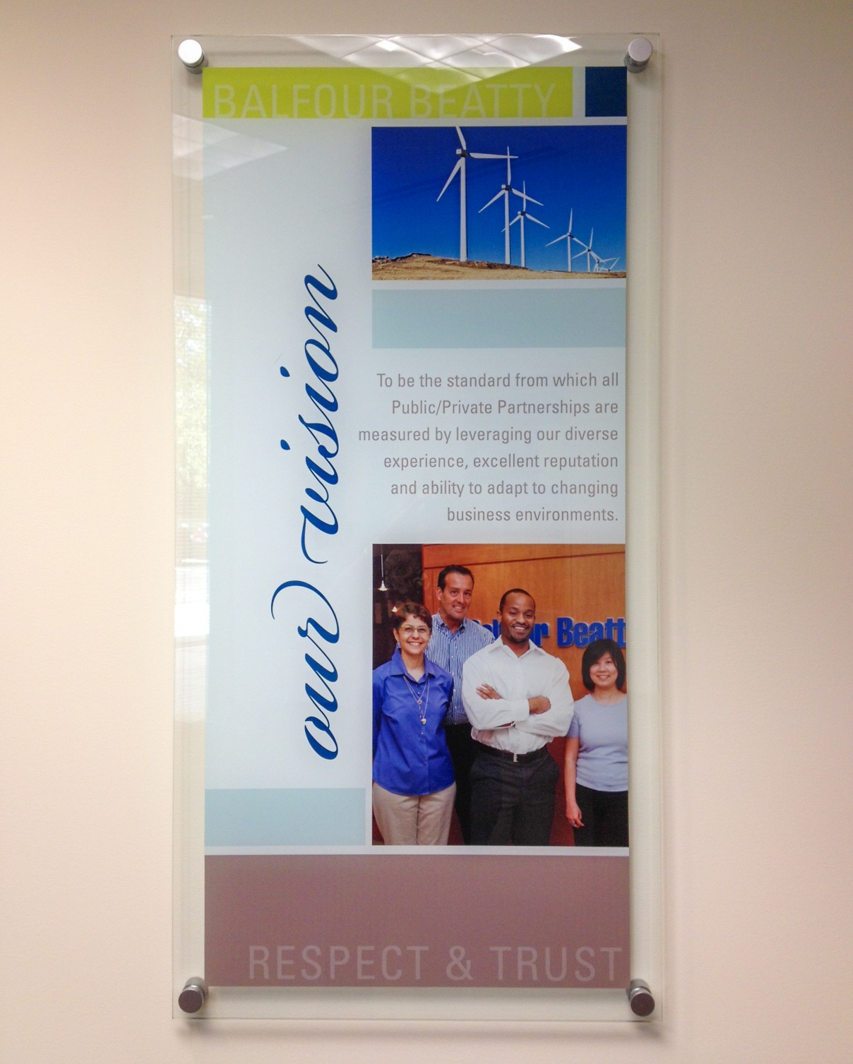 Large acrylic wall sign on aluminum standoffs