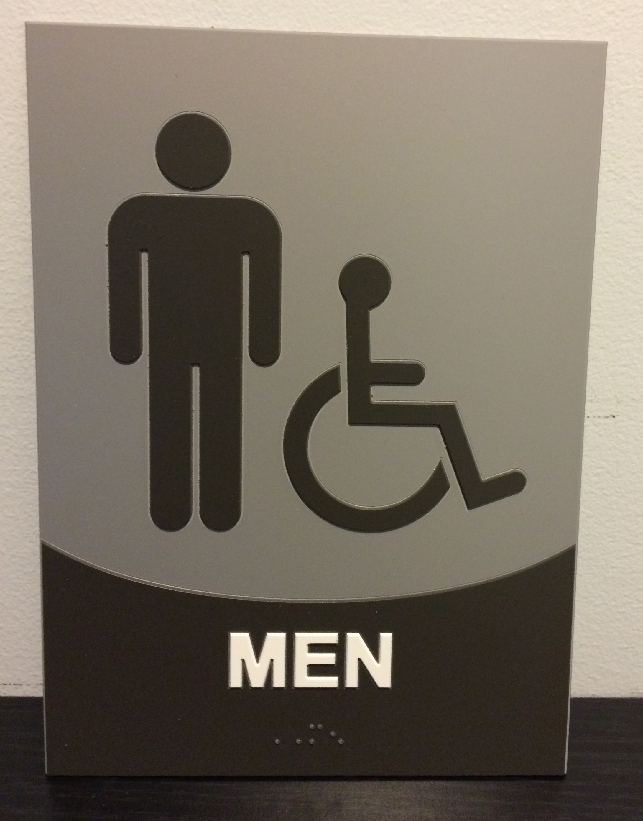 Custom restroom ADA sign on brushed aluminum