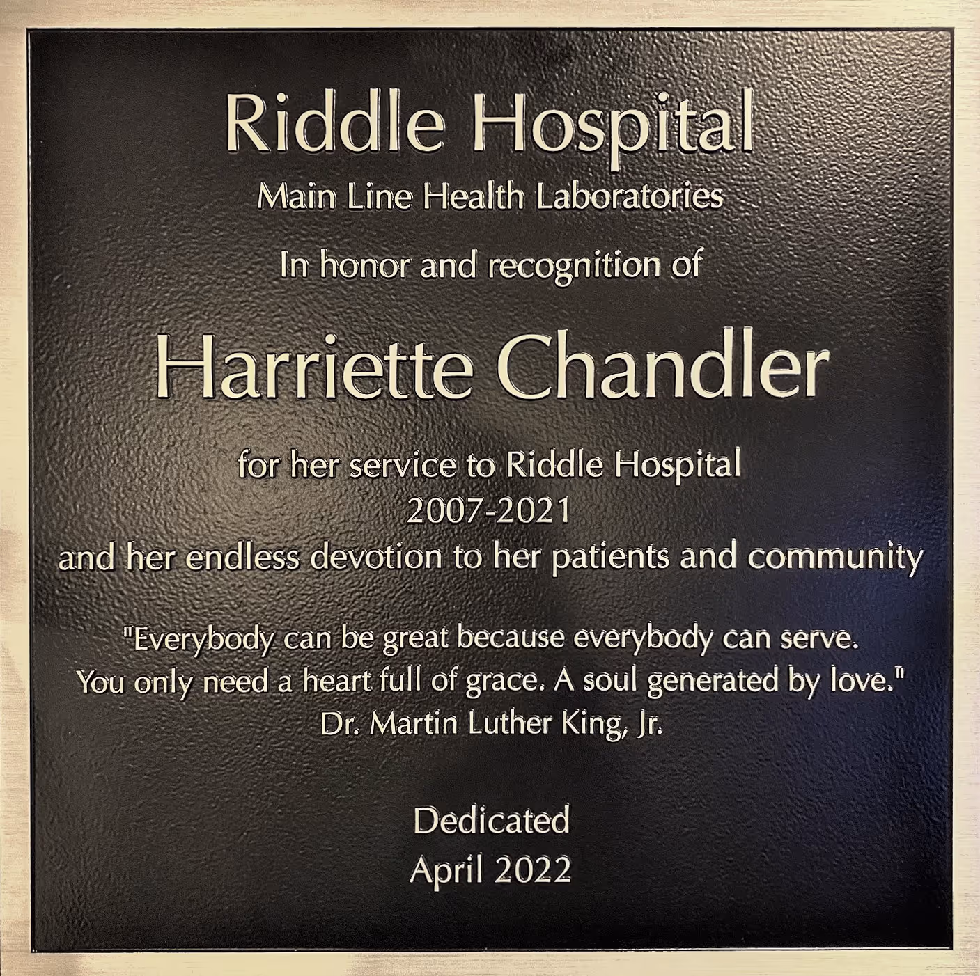 Rectangular plaque produced with precision-tooled bronze