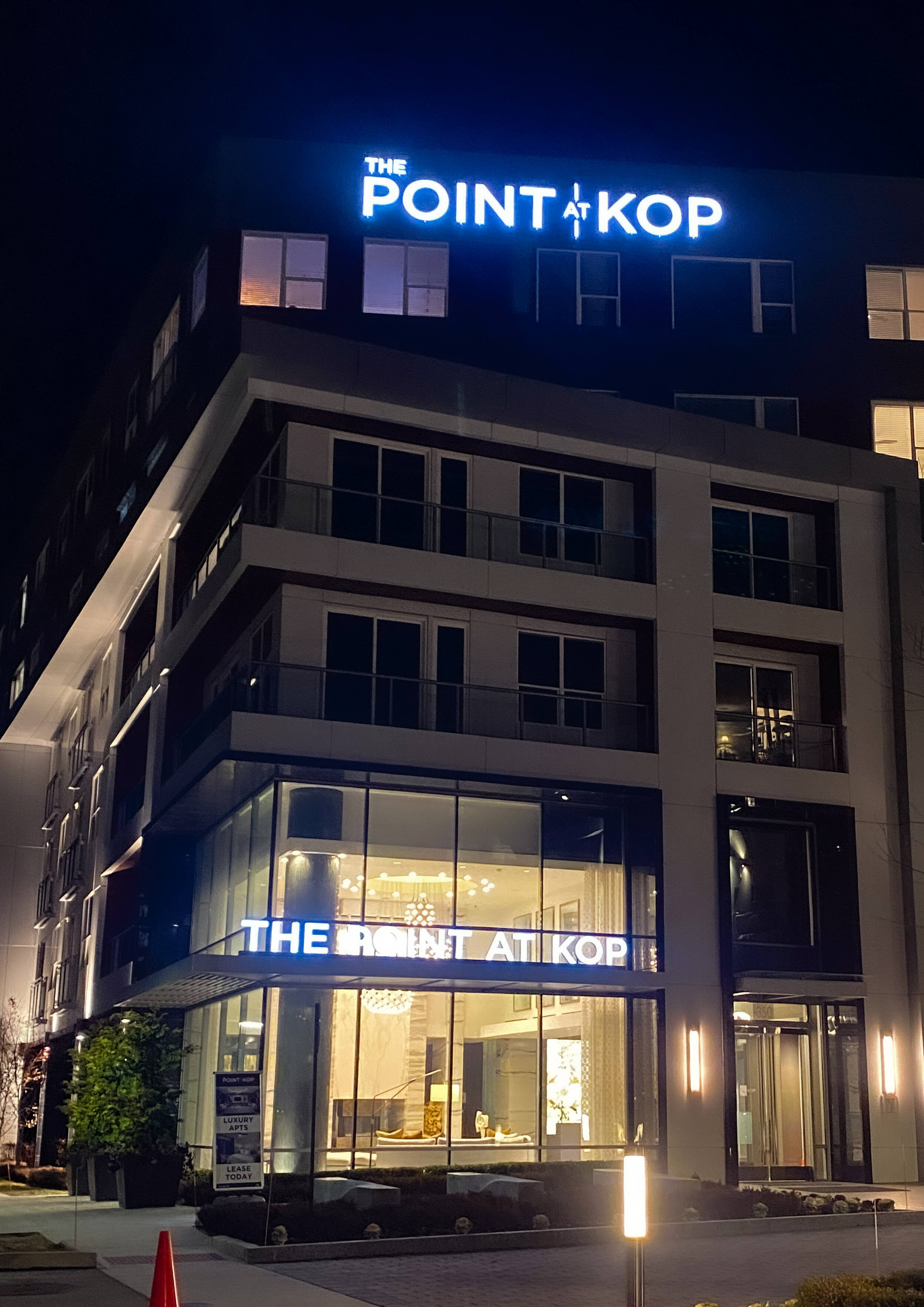 Illuminated channel letters mounted just below the roof line