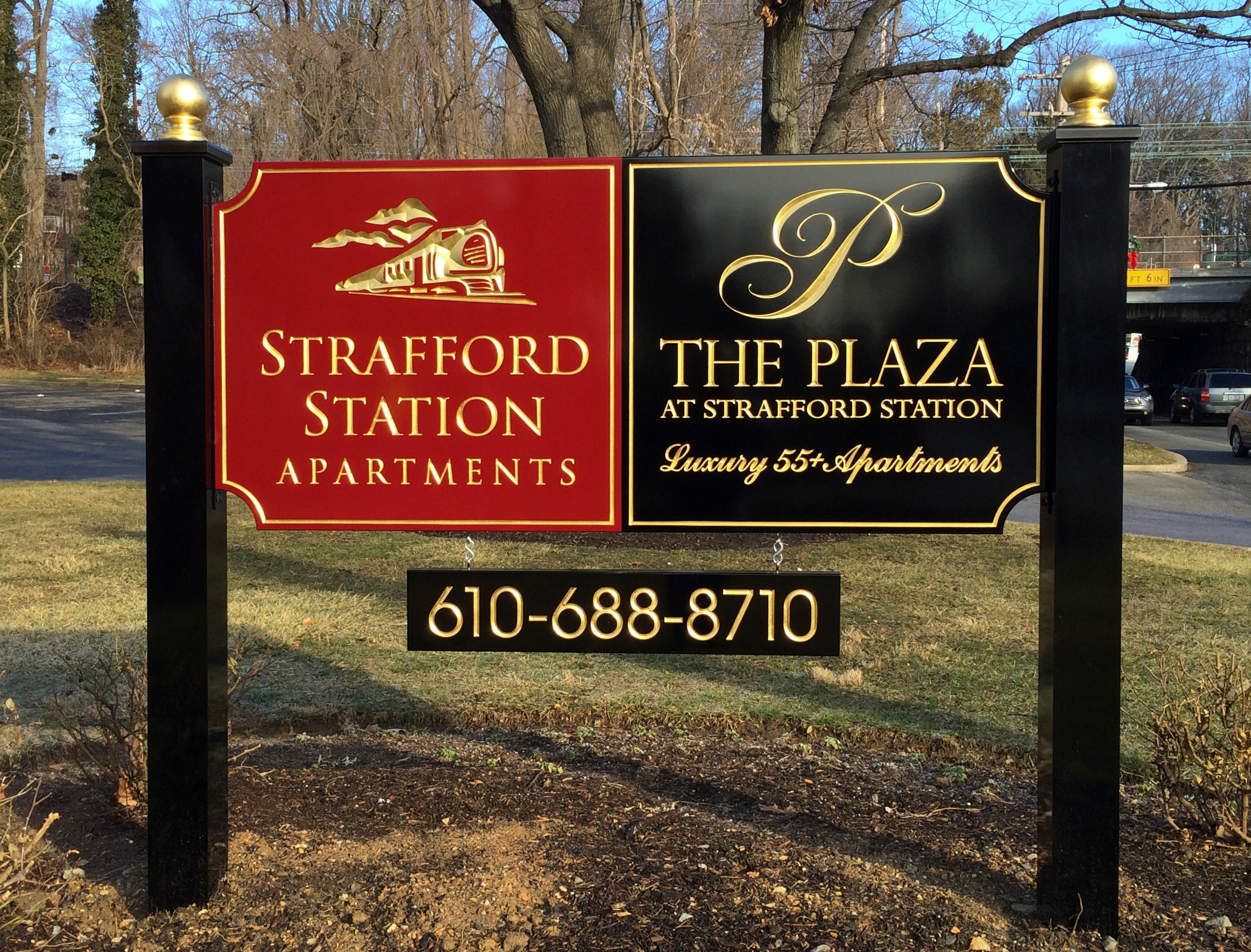 Two-toned carved HDU sign on dual posts with finials
