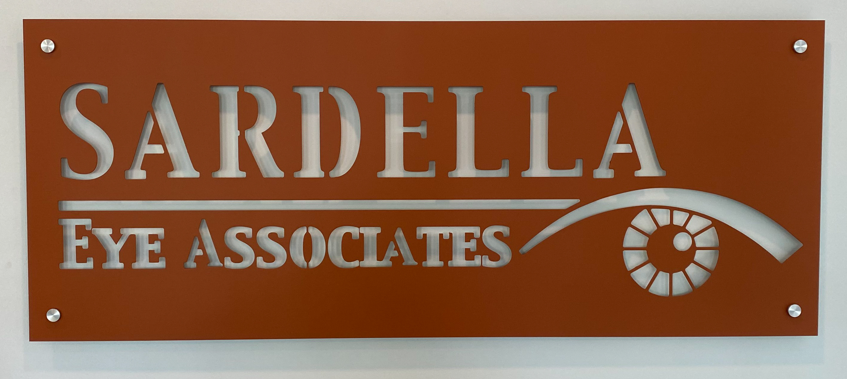 Orange routered-aluminum wall sign mounted with standoffs