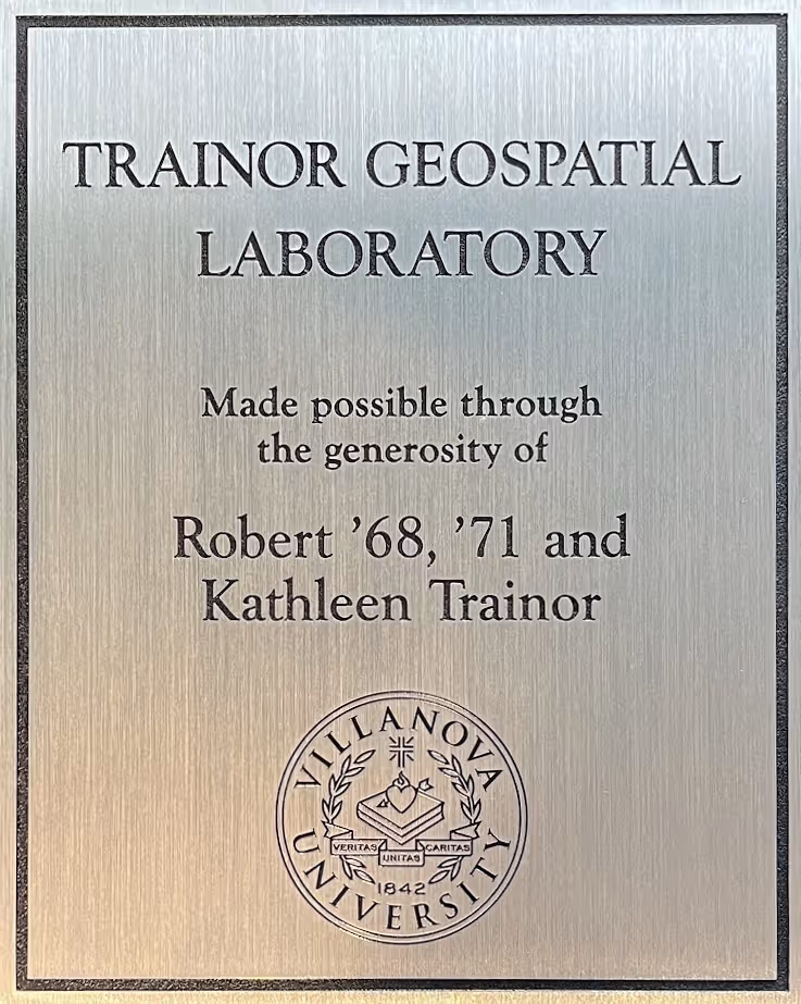 Etched stainless steel plaque with detailed university seal