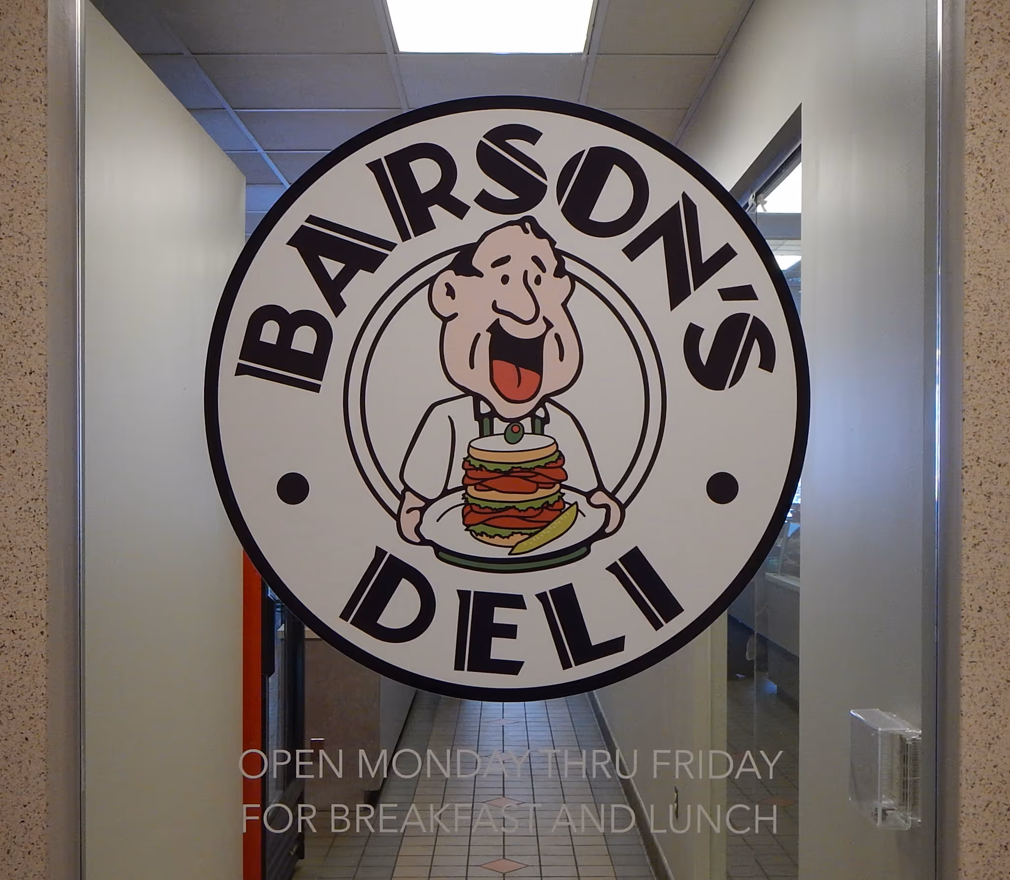 Deli logo vinyled on their front door glass