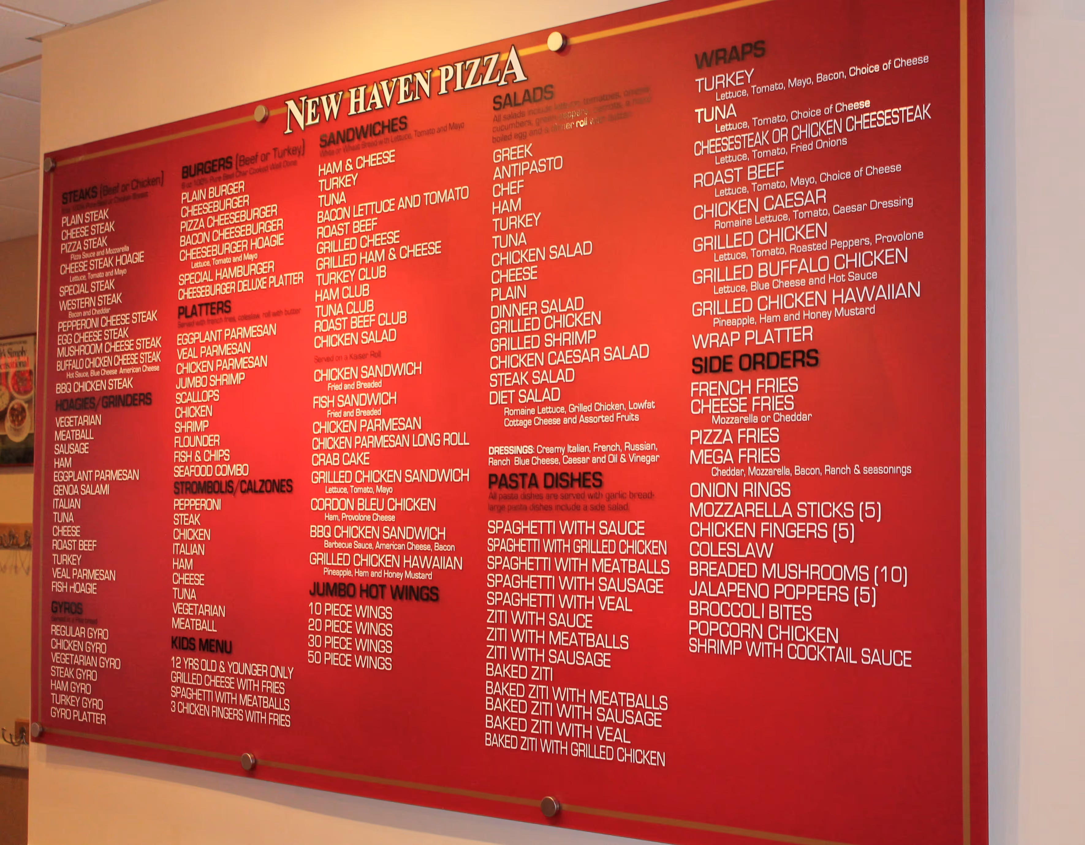 Restaurant menu vinyled onto a large, red acrylic wall sign