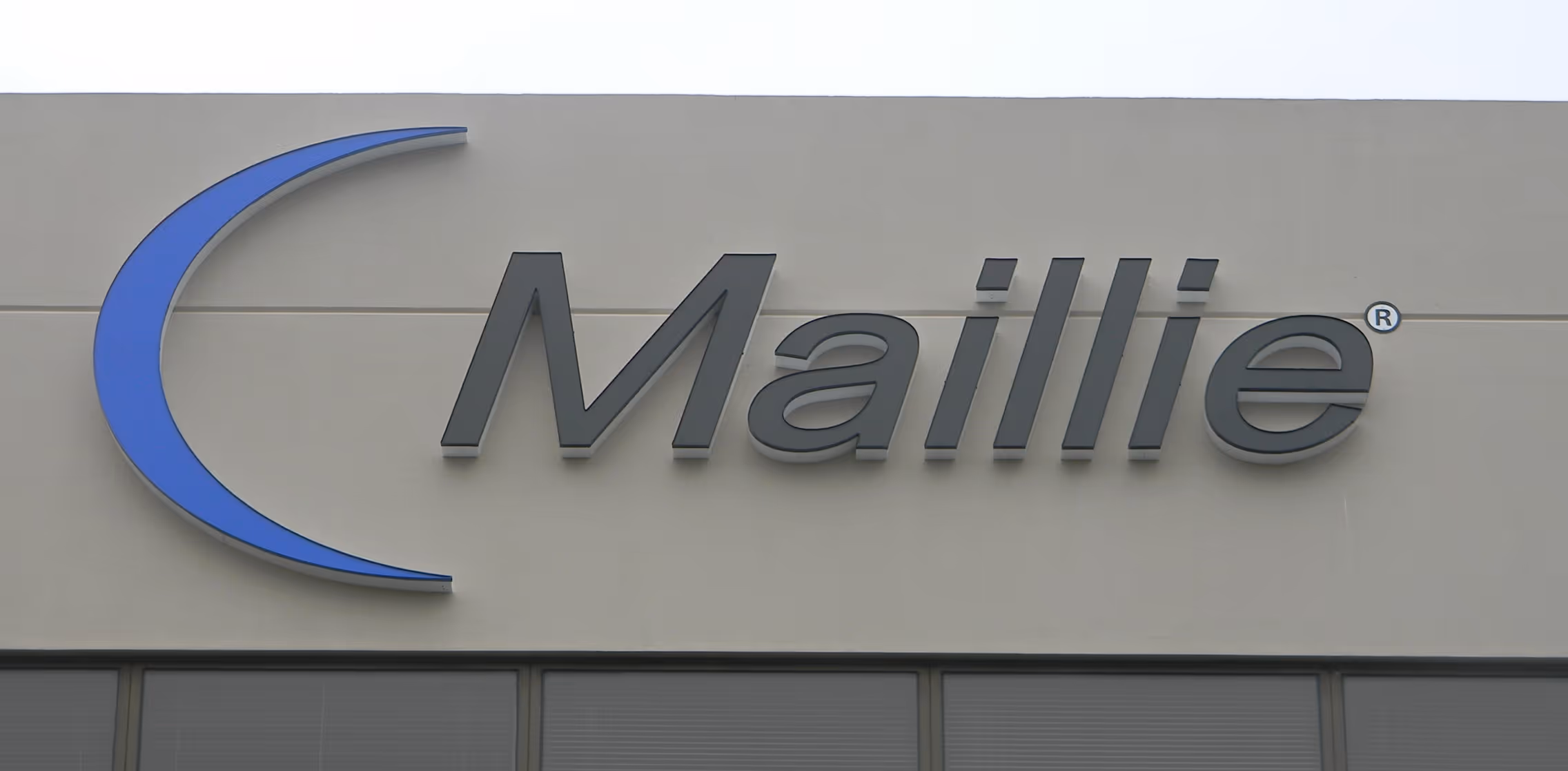 Blue and gray channel letters and logo