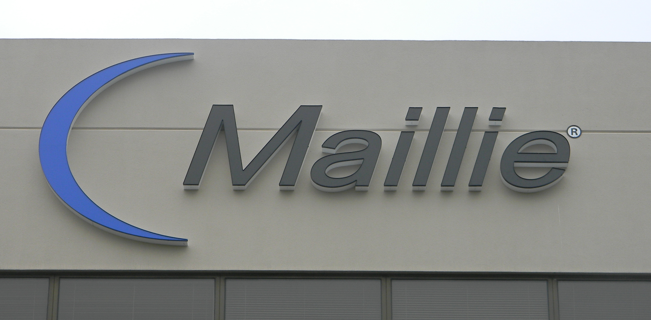 Blue and gray channel letters and logo