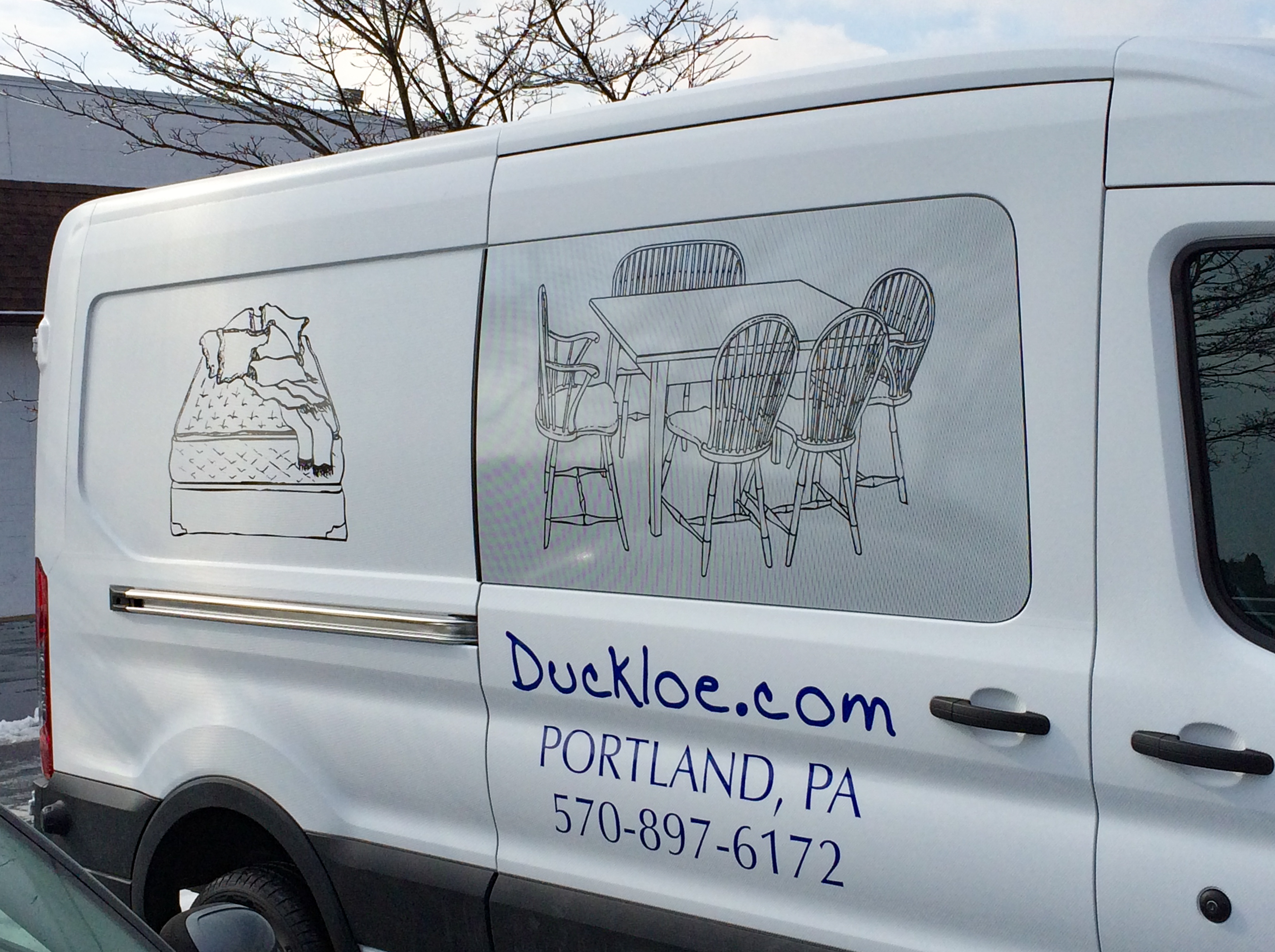 Plotted and weeded vinyl on a large white panel van