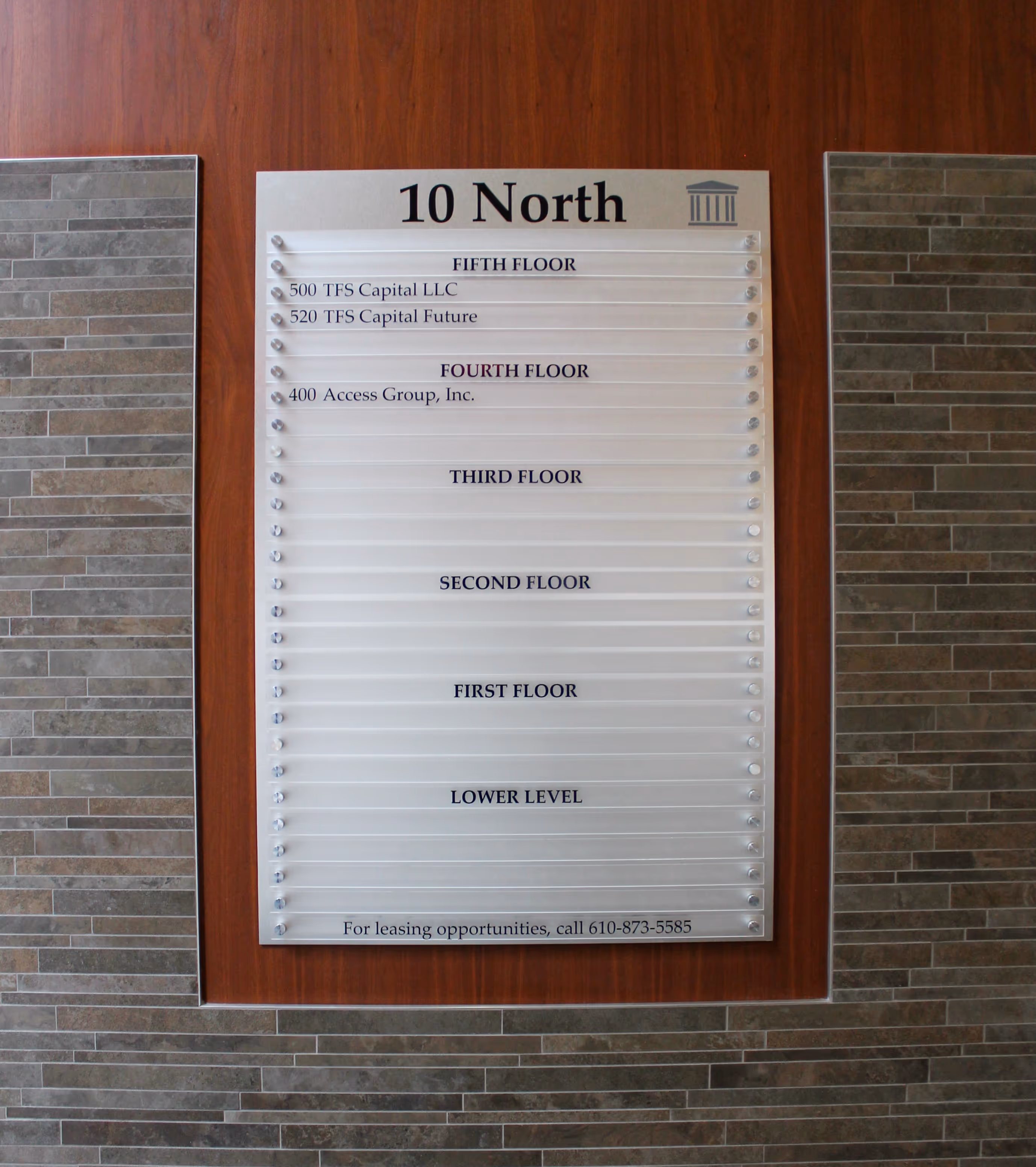 Building directory with frosted acrylic slats mounted with standoffs