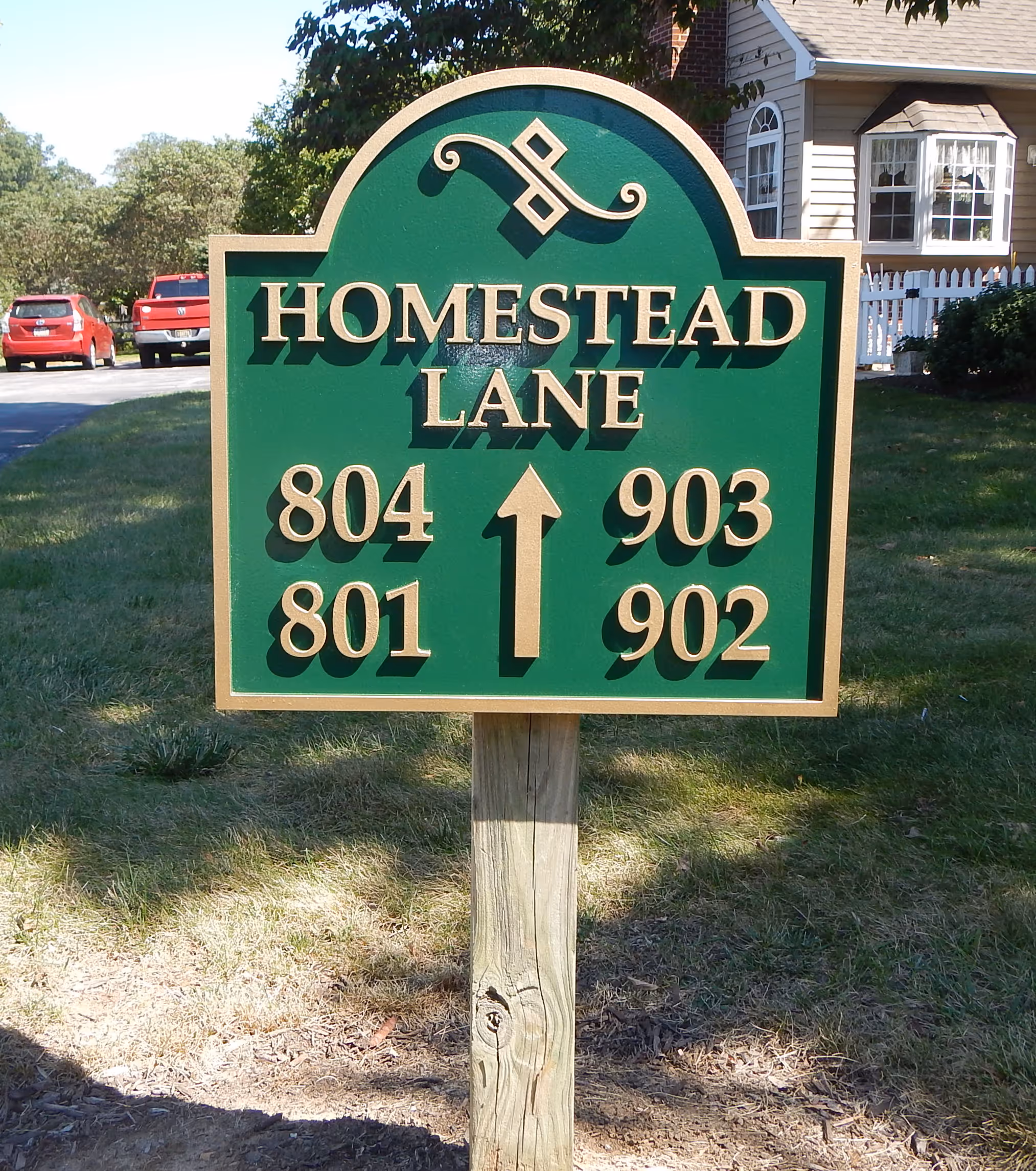 Carved HDU sign mounted on a post
