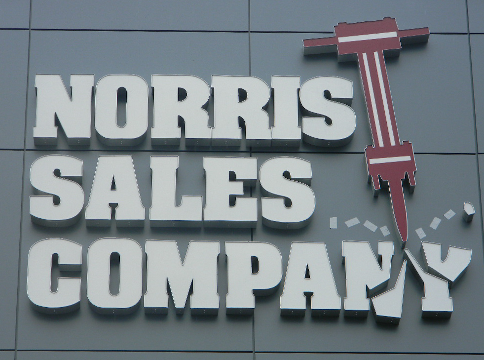 White channel letters with large red logo