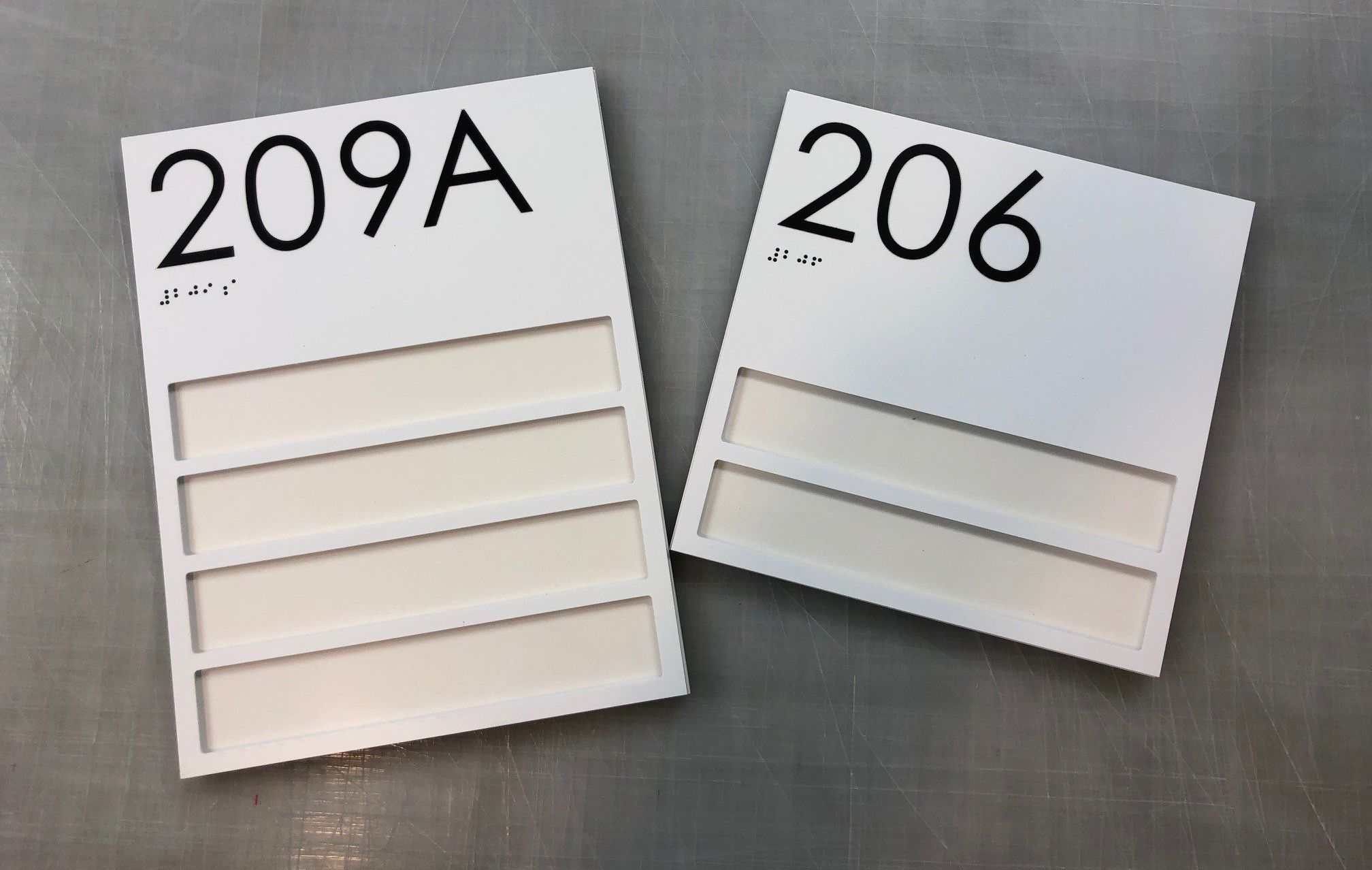 Custom black and white room signs with multiple windows
