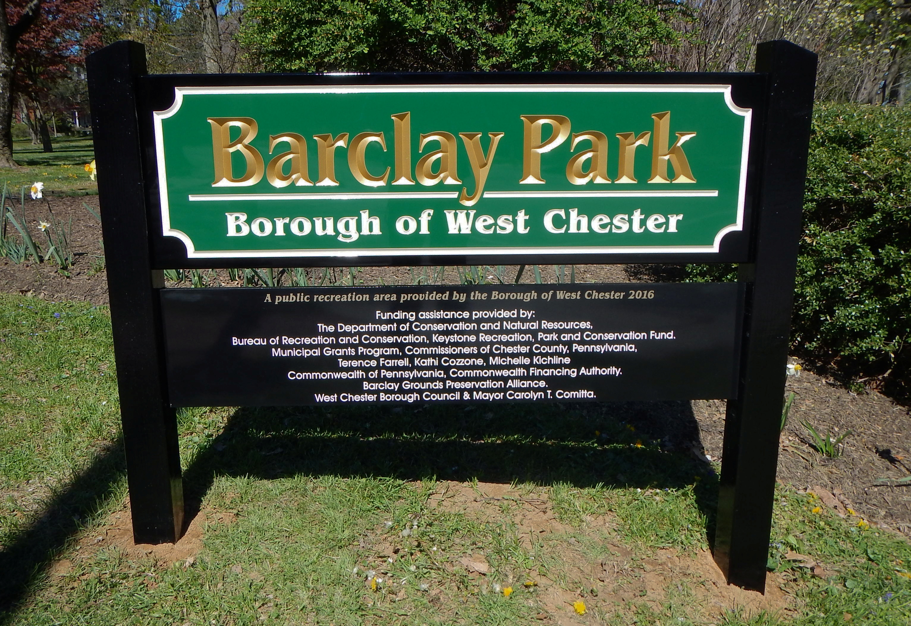 Carved HDU sign on dual black posts