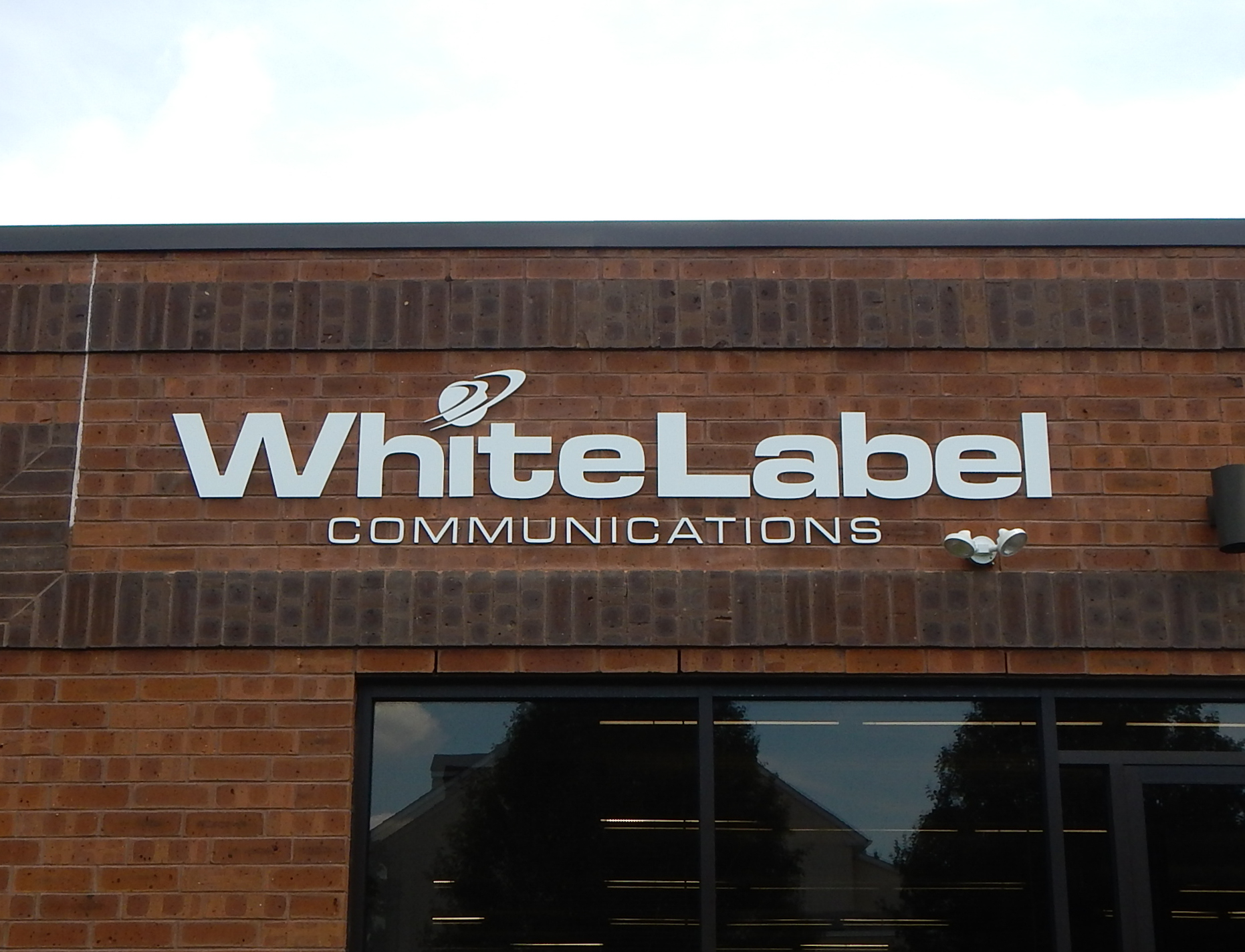 Exterior, acrylic dimensional letters on a brick wall