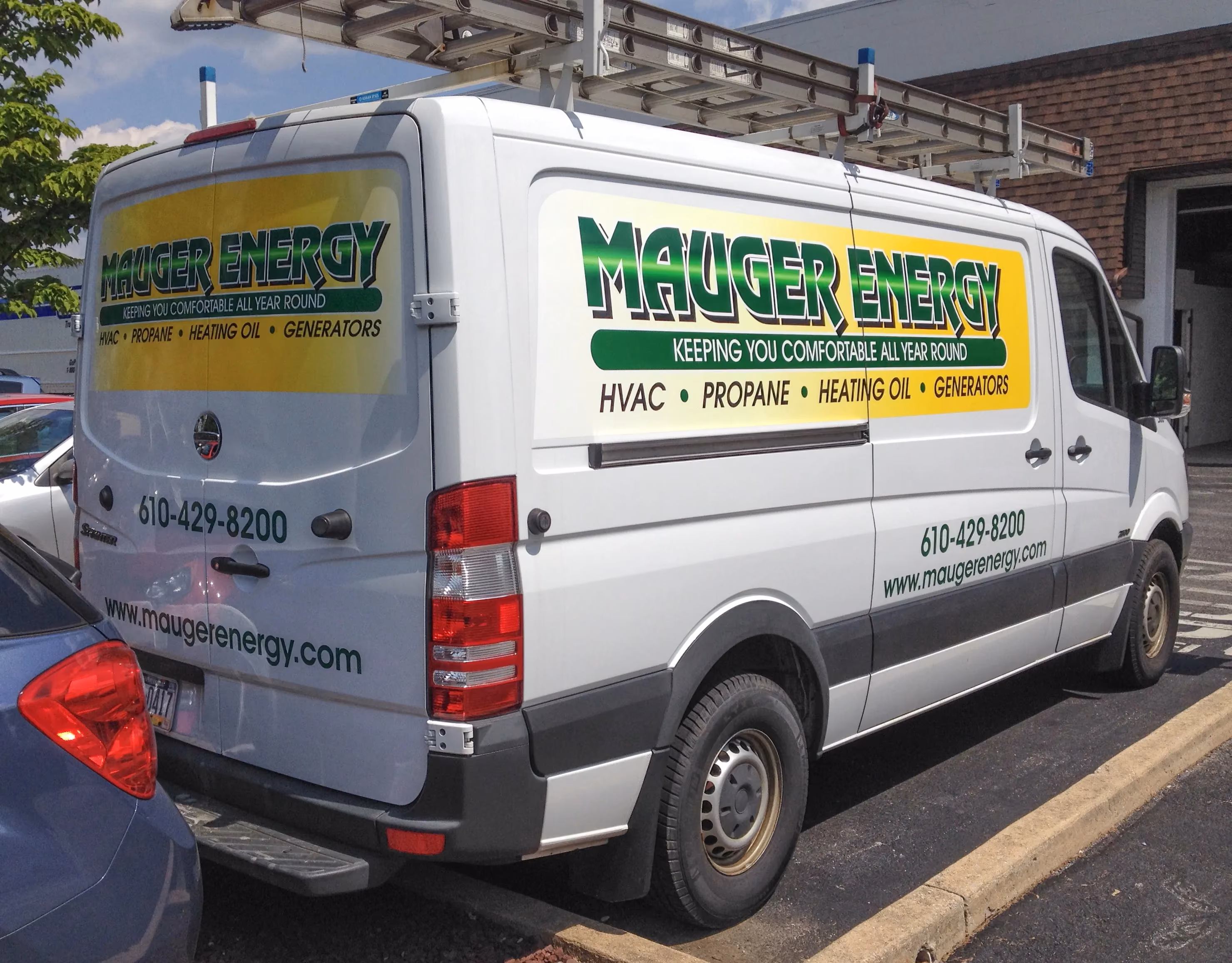 Green and yellow vehicle wrap on a utility vehicle