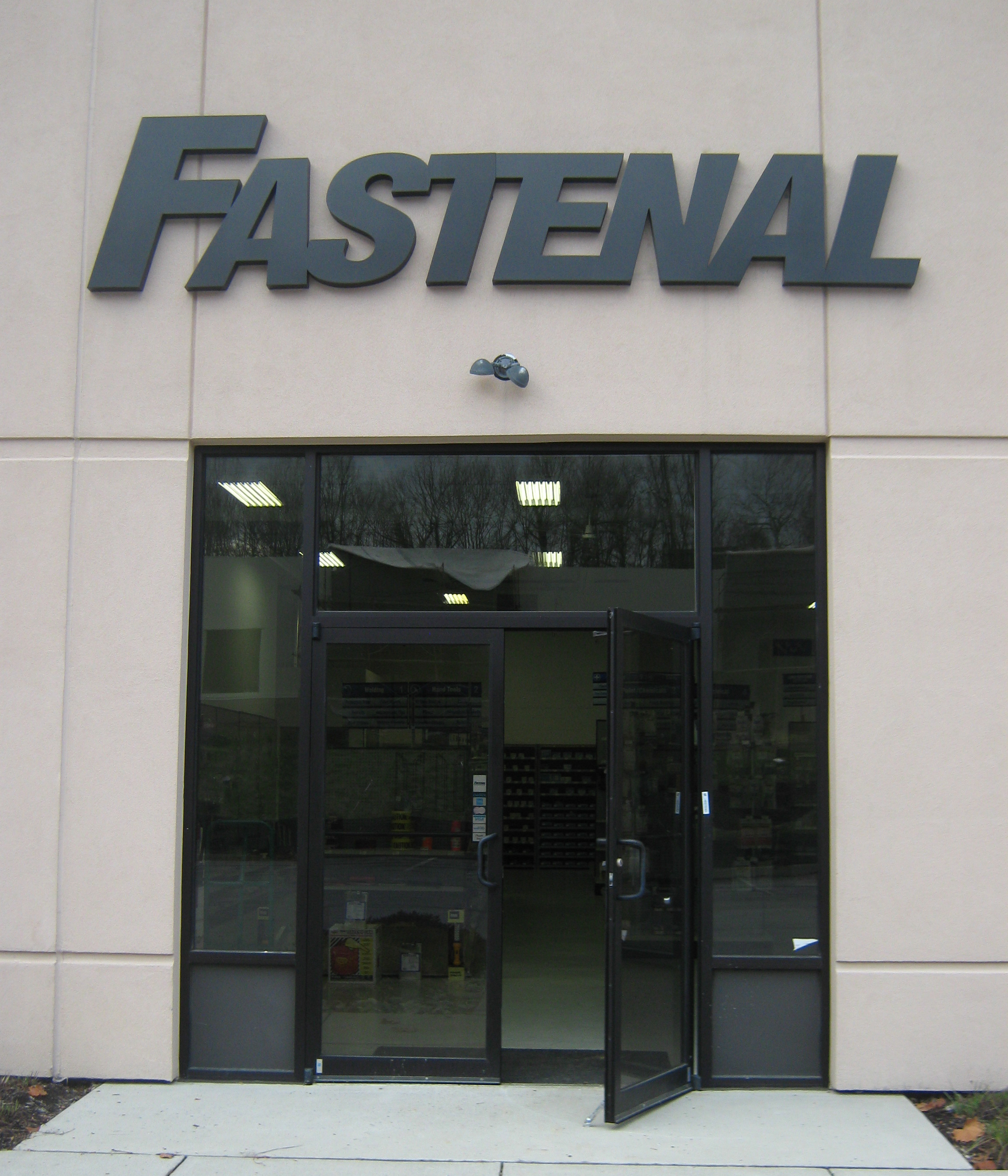 Custom font dimensional letters in gray above a doorway