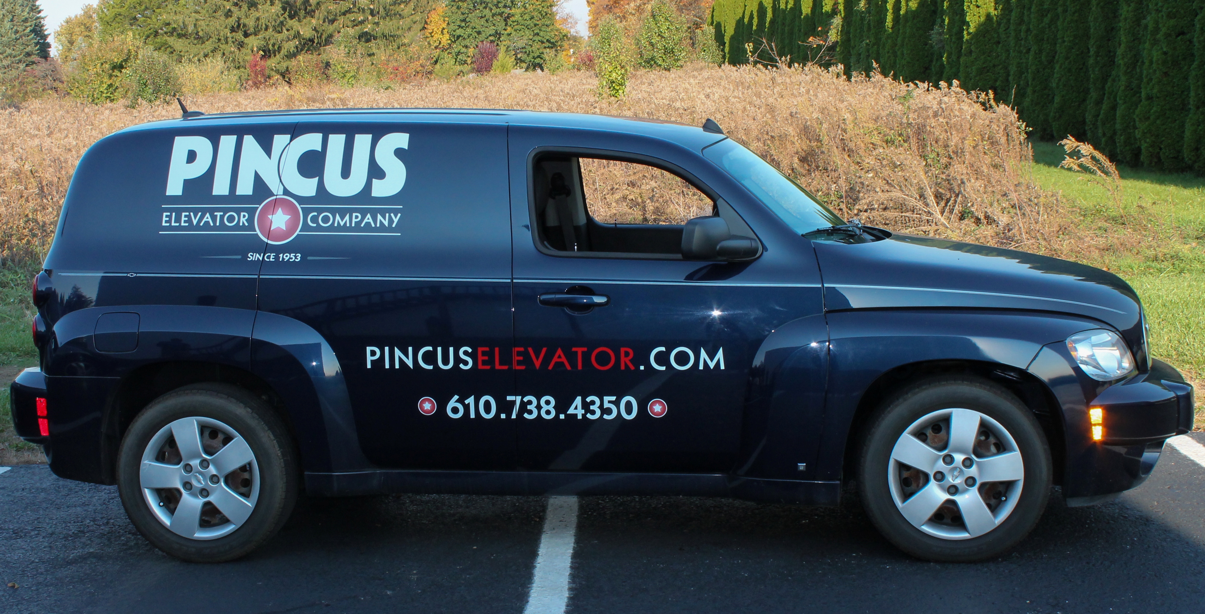 Custom car wrap on a black PT Cruiser