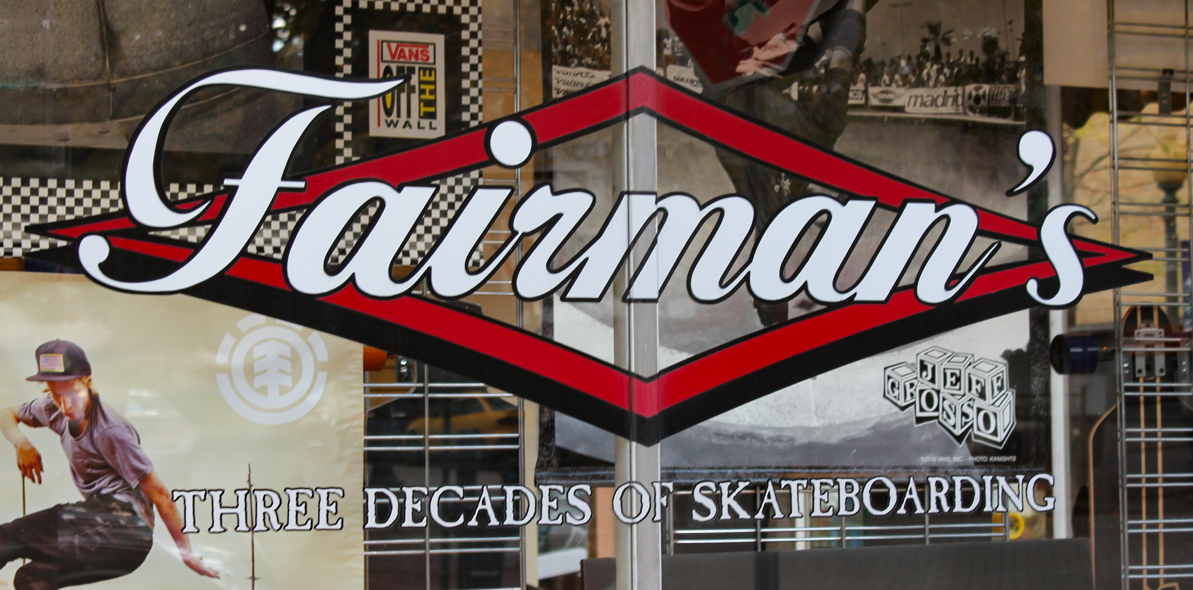 Custom vinyl logo on a storefront window