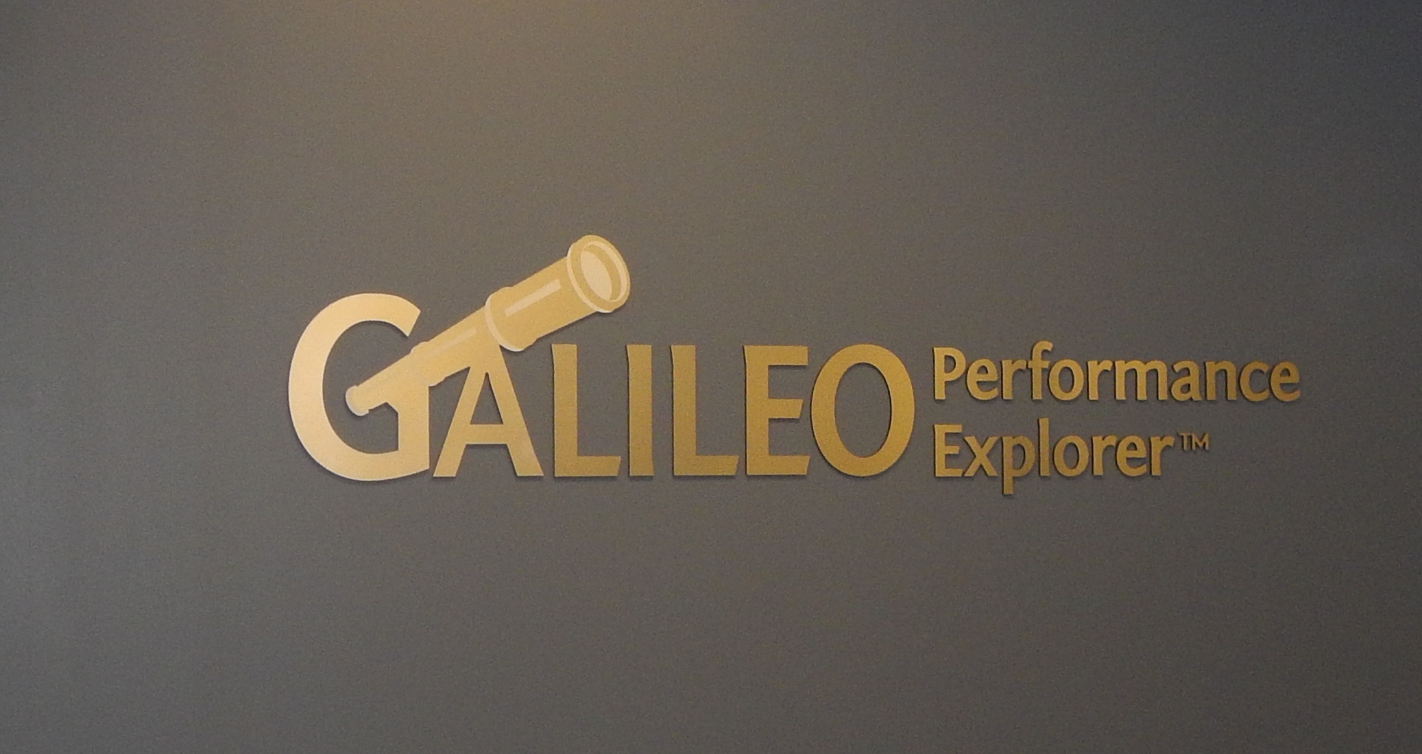 Gold, custom-font dimensional letters with company logo
