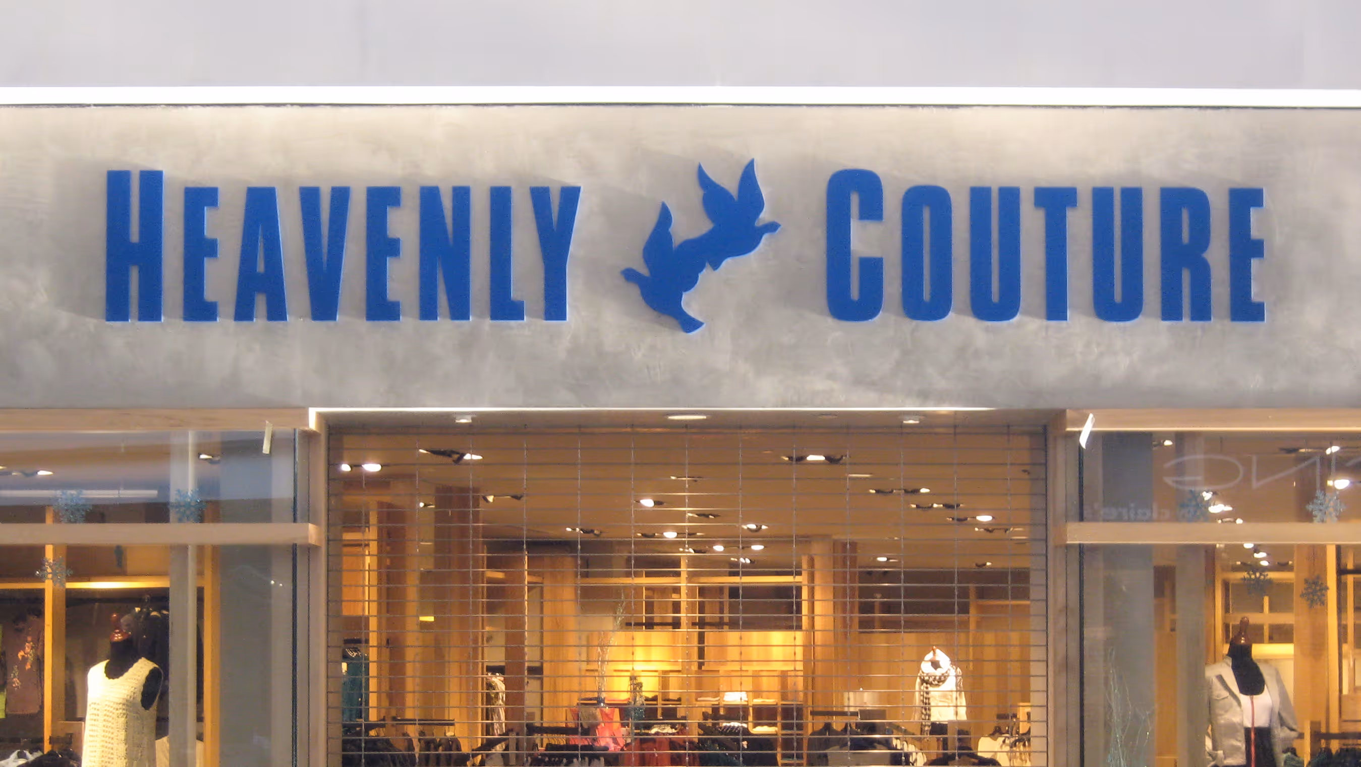 Blue halo-lit channel letters in a shopping mall