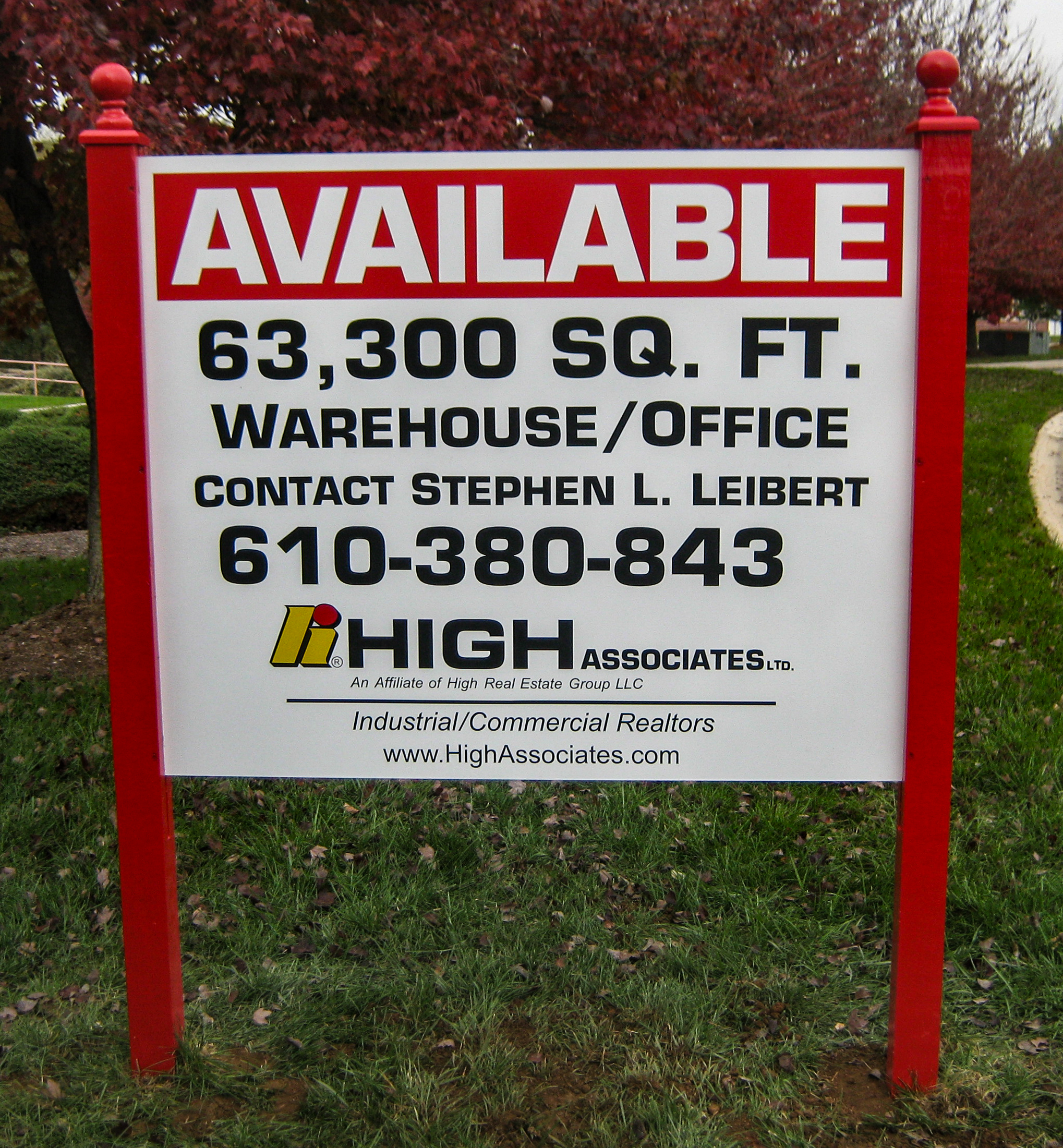 Large post and panel sign with red finials