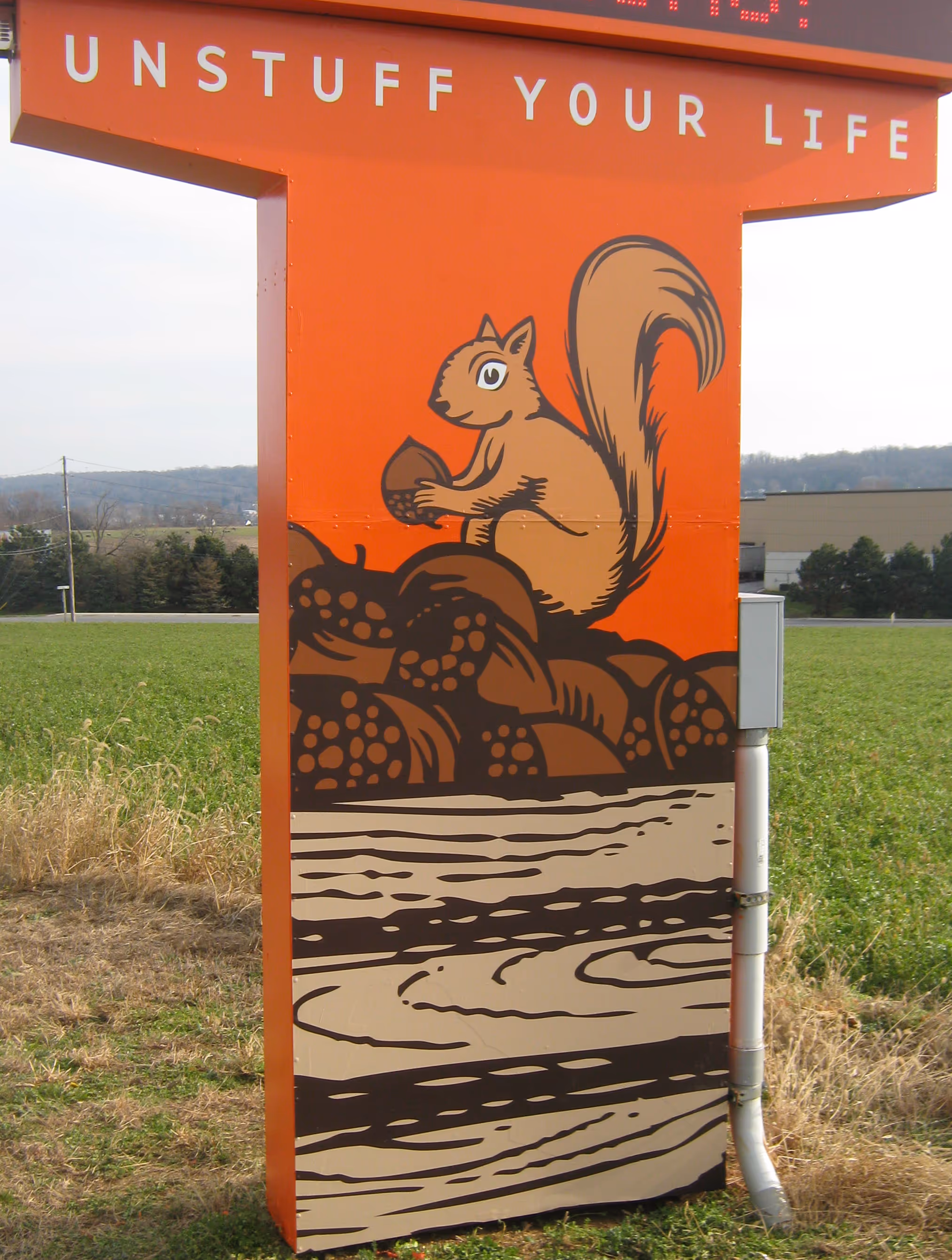 Large custom viny graphic on the pillar of an aluminum monument sign