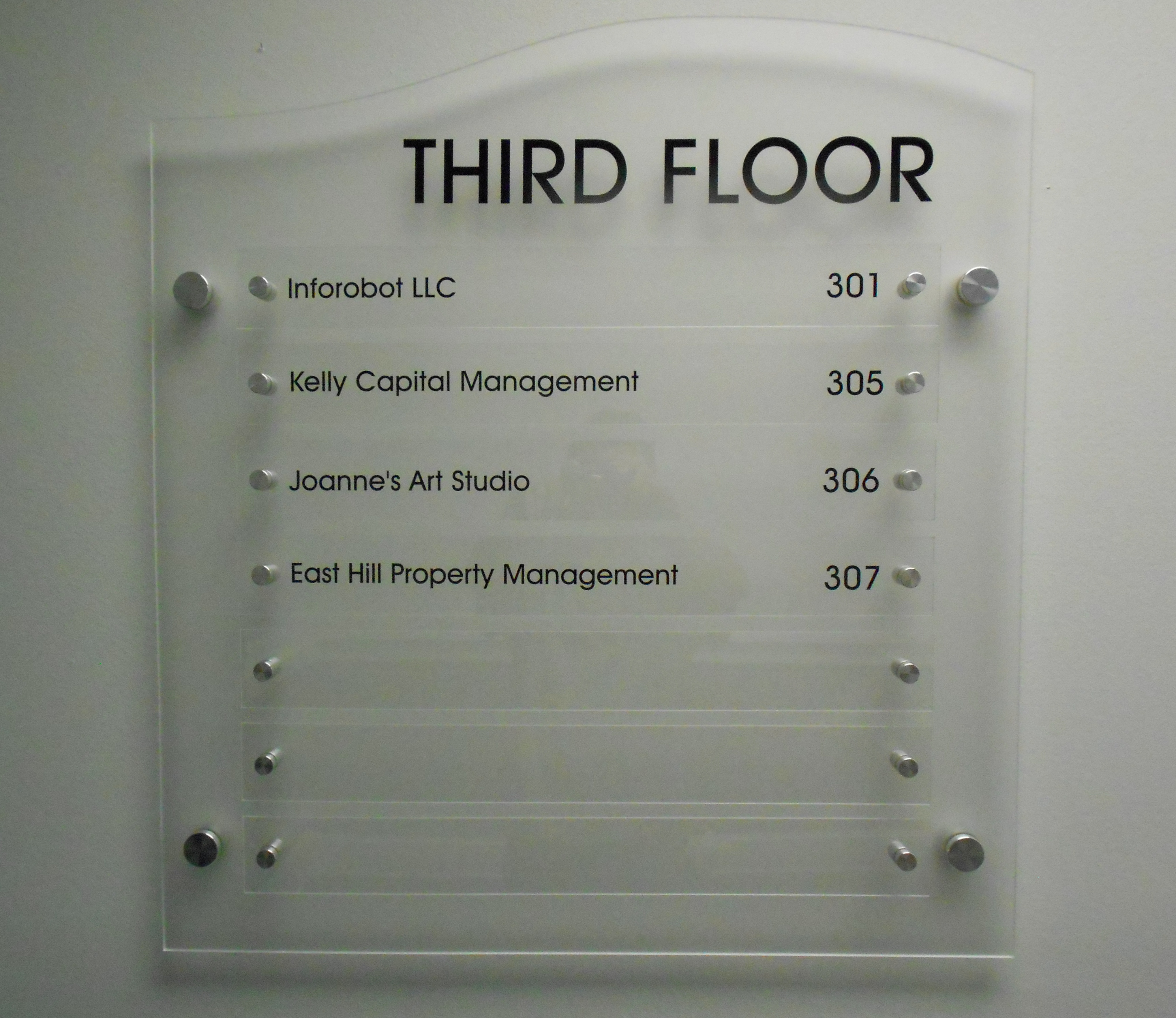 Custom-shaped building directory with black vinyl