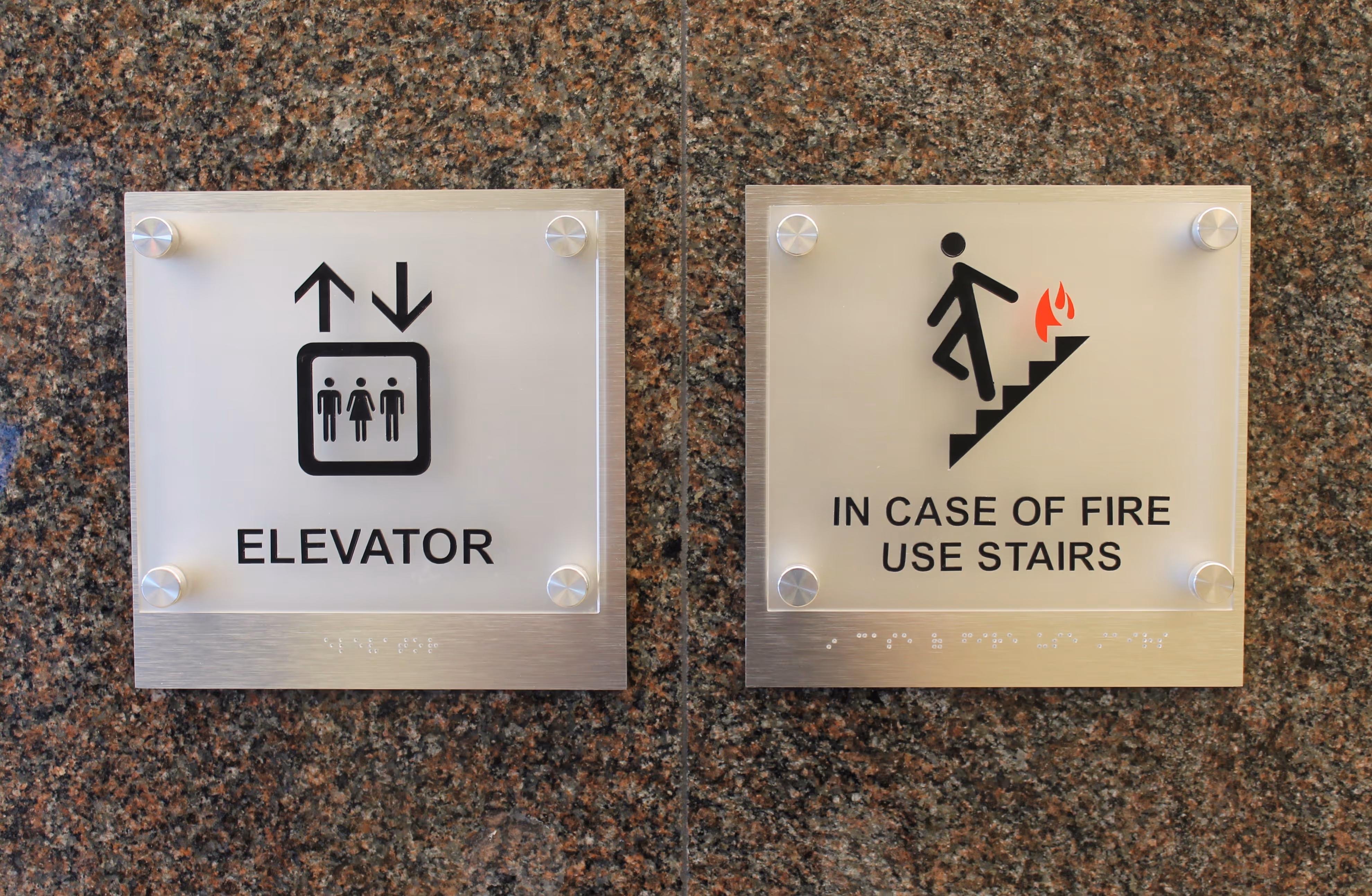 Brushed aluminum elevator and stairs ADA signs