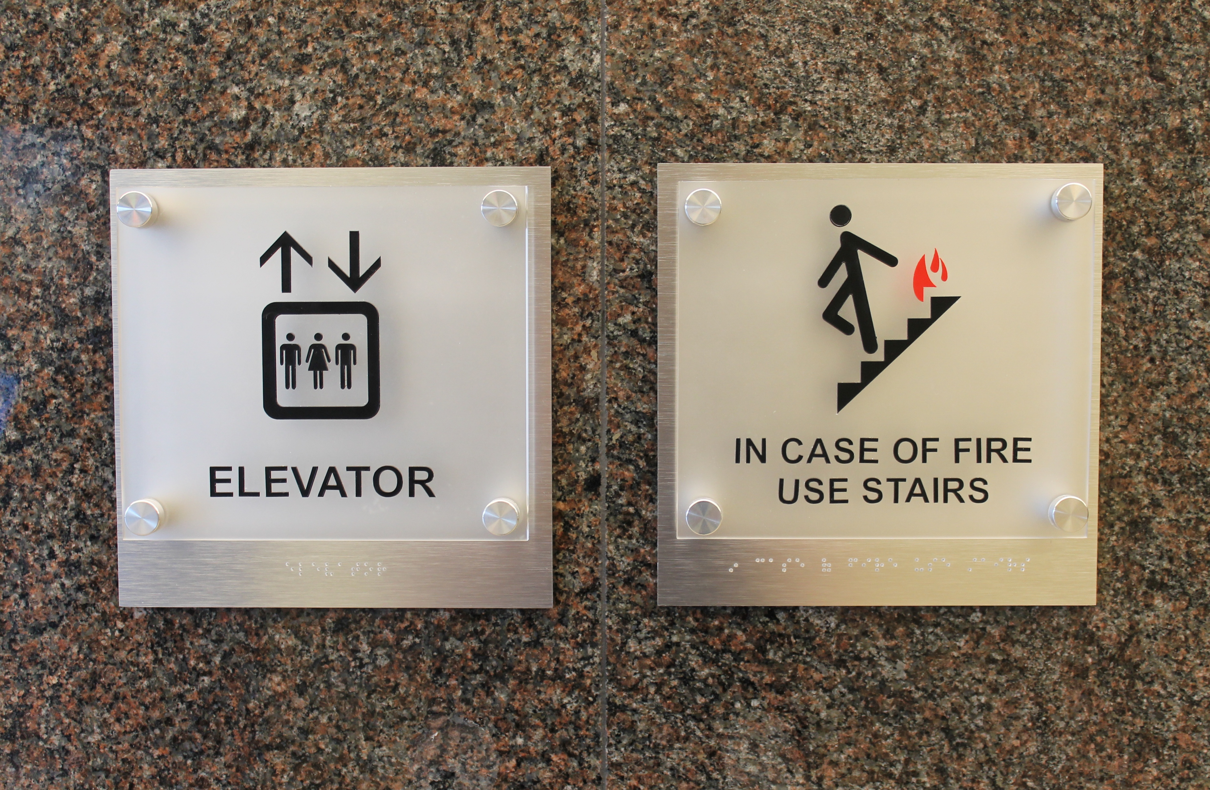Custom elevator ADA signs with acrylic mounted on brushed aluminum with standoffs