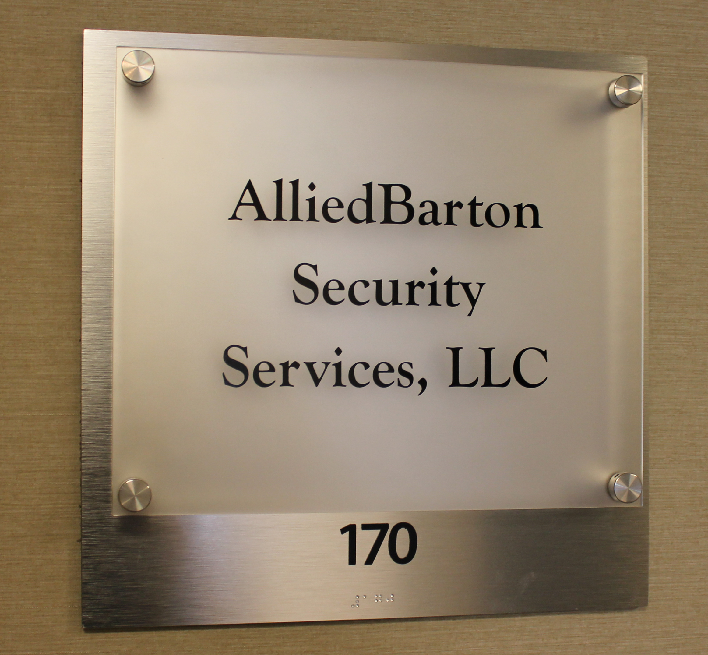 ADA room sign customized with brushed aluminum backer
