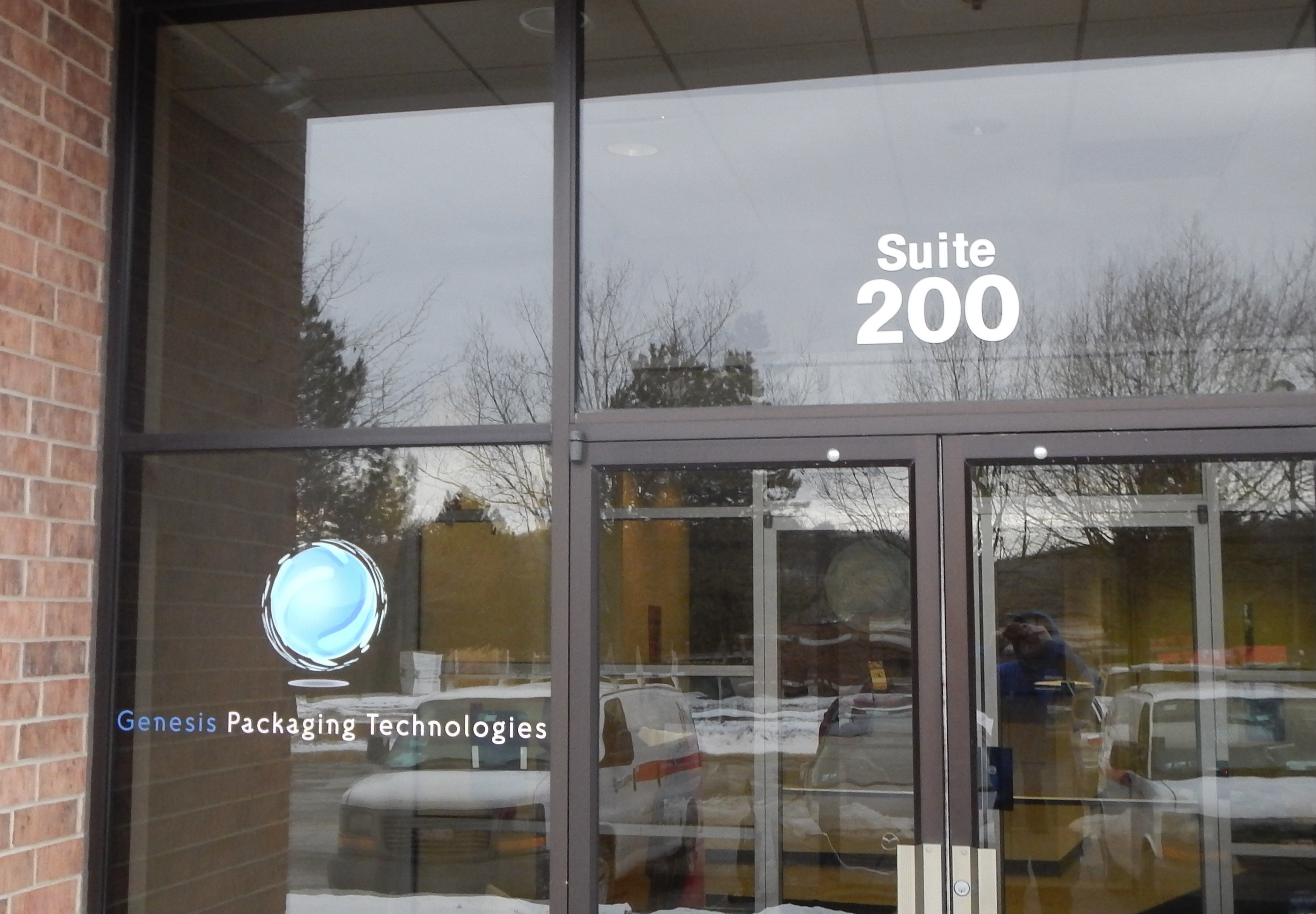 Building ID vinyled on the transom over the exterior door