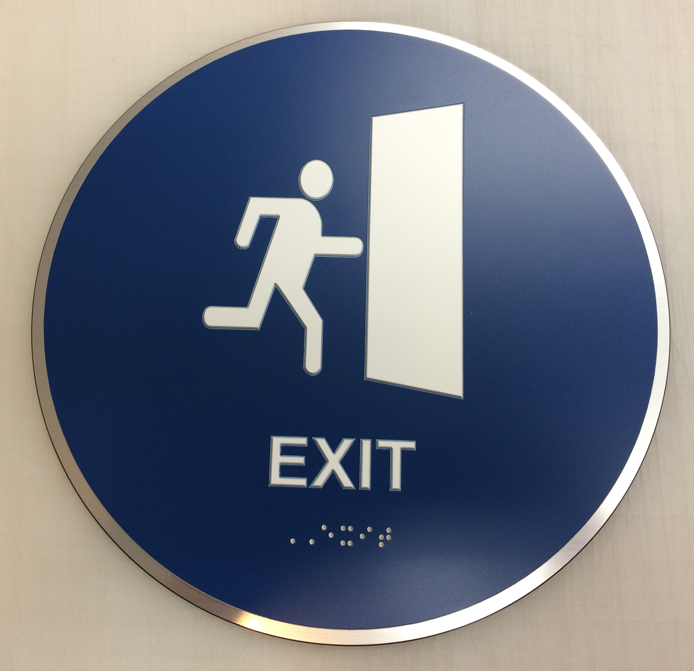 Circular, blue ADA exit sign