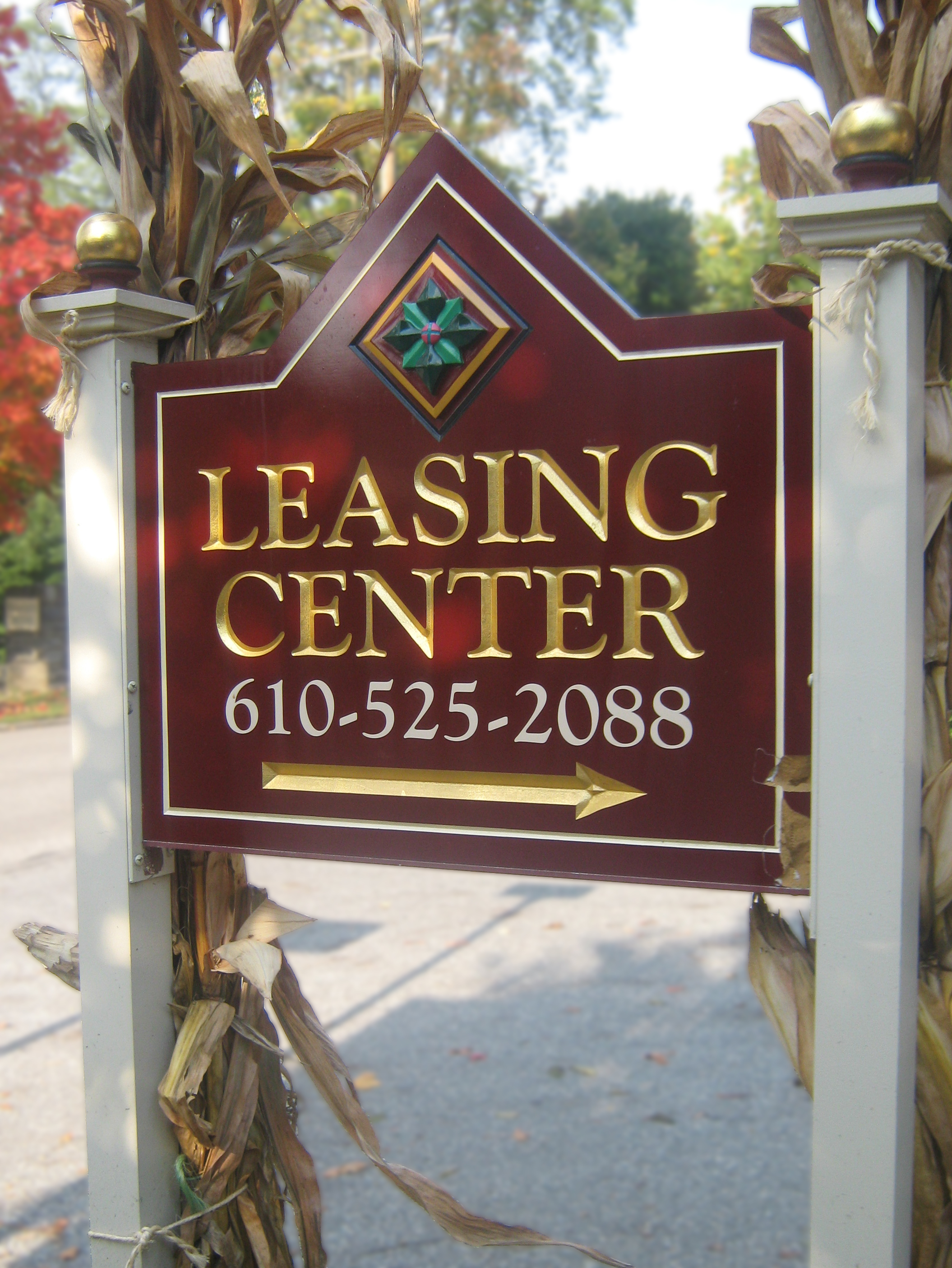 Custom HDU sign for a leasing center mounted on two posts