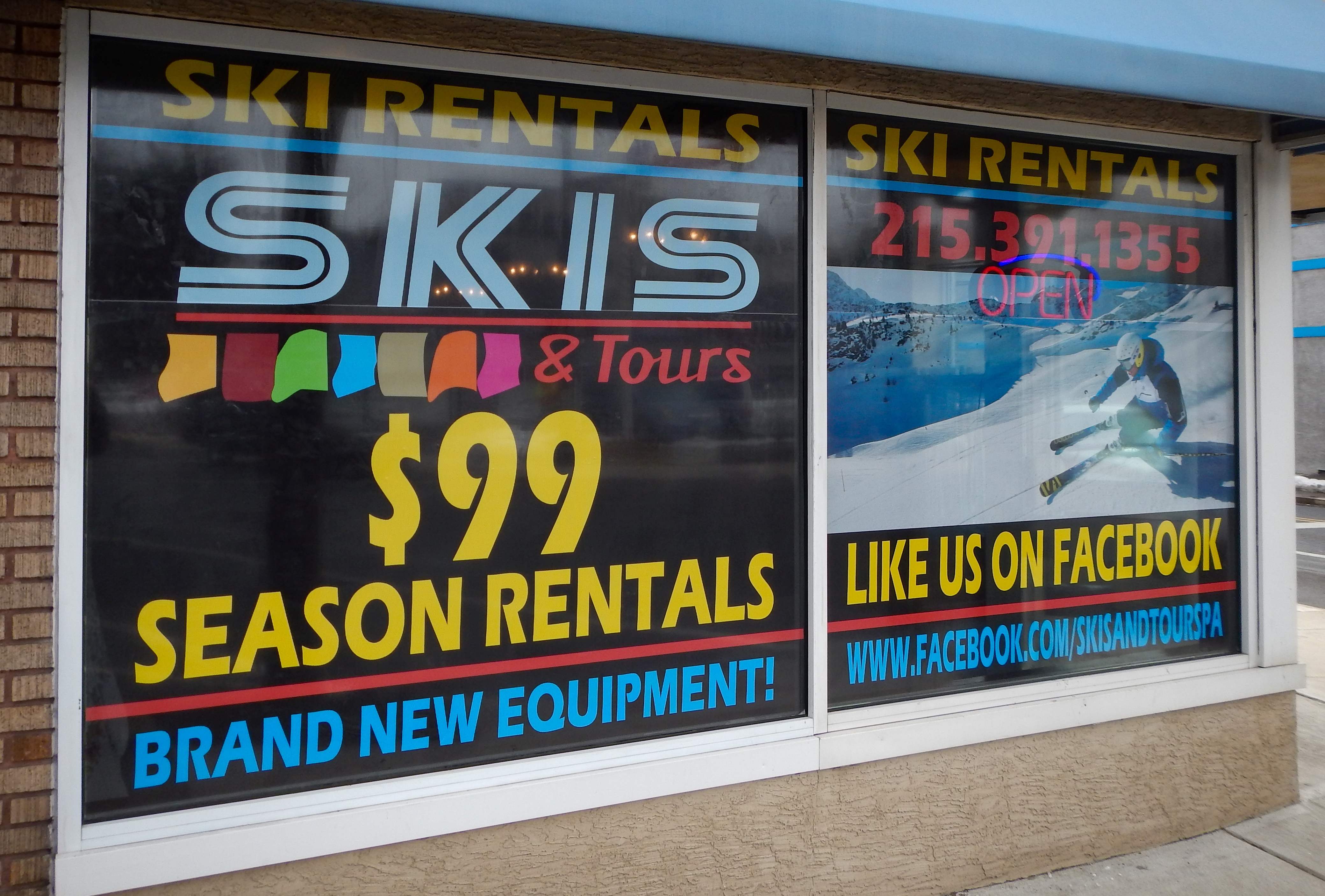 Vinyl lettering announcing a sale in a storefront window