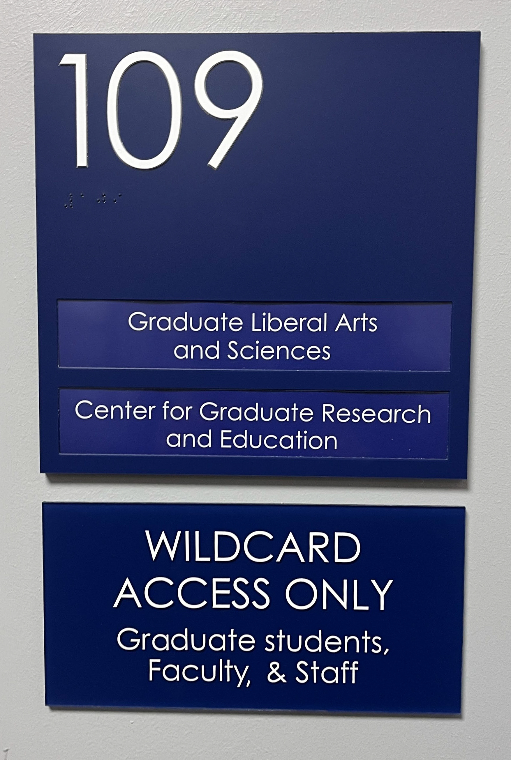 Blue acrylic ADA sign with double-window