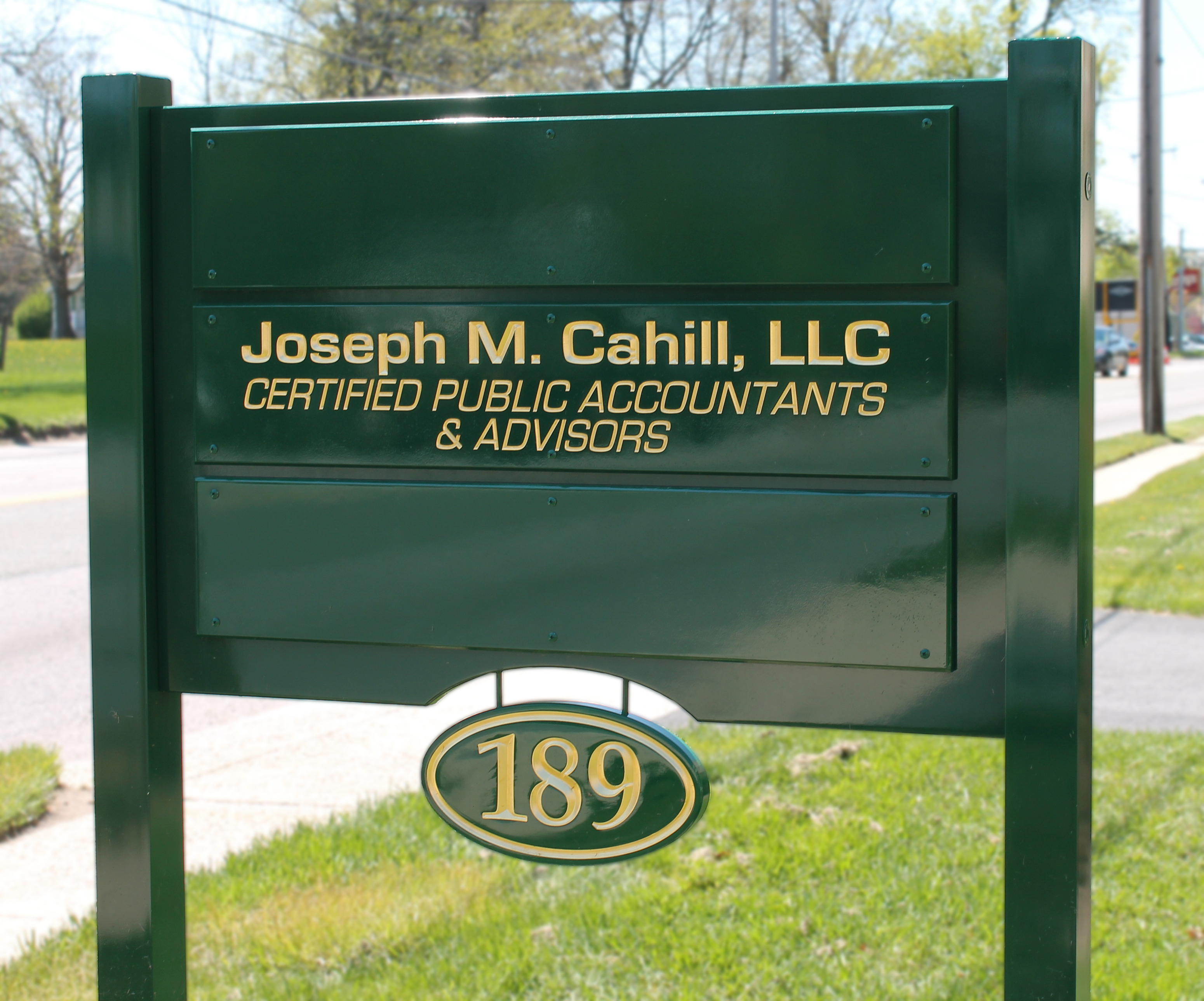 Post and panel sign with carved tenant planks and building number
