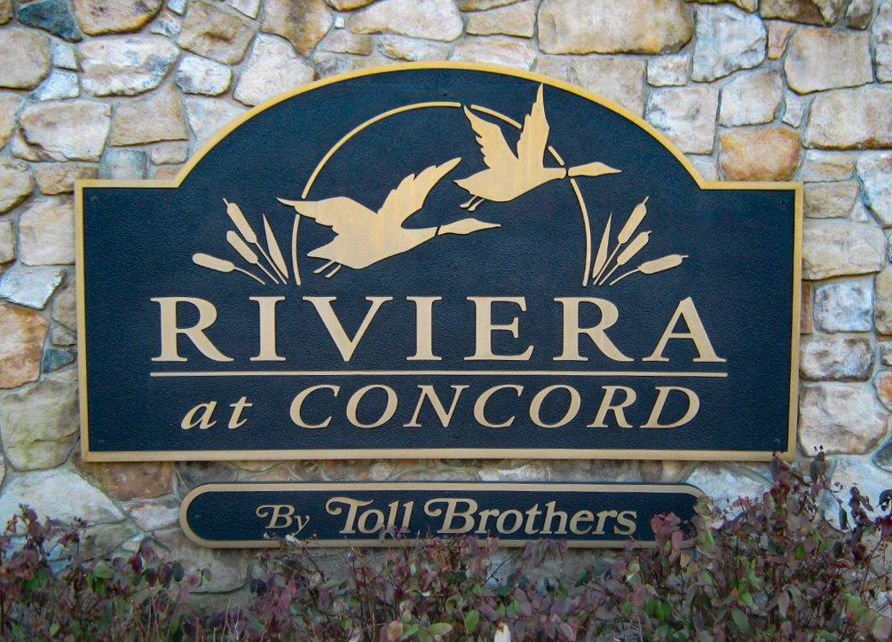 Carved  HDU sign mounted on a large stone base