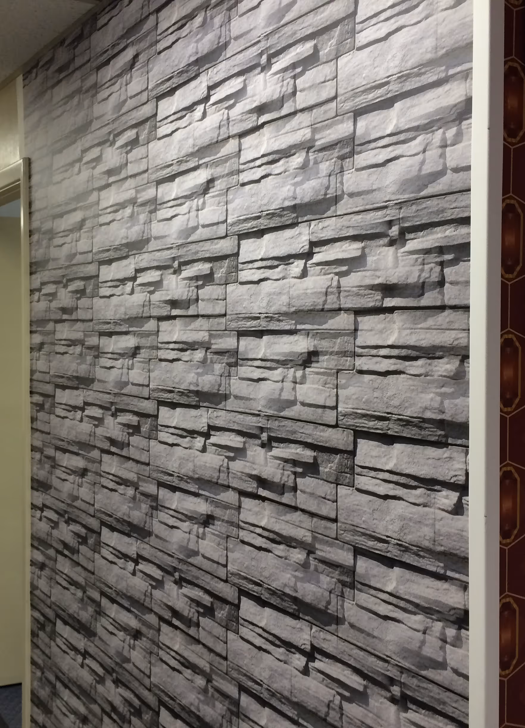 Vinyl full-wall graphic of a textured stone wall