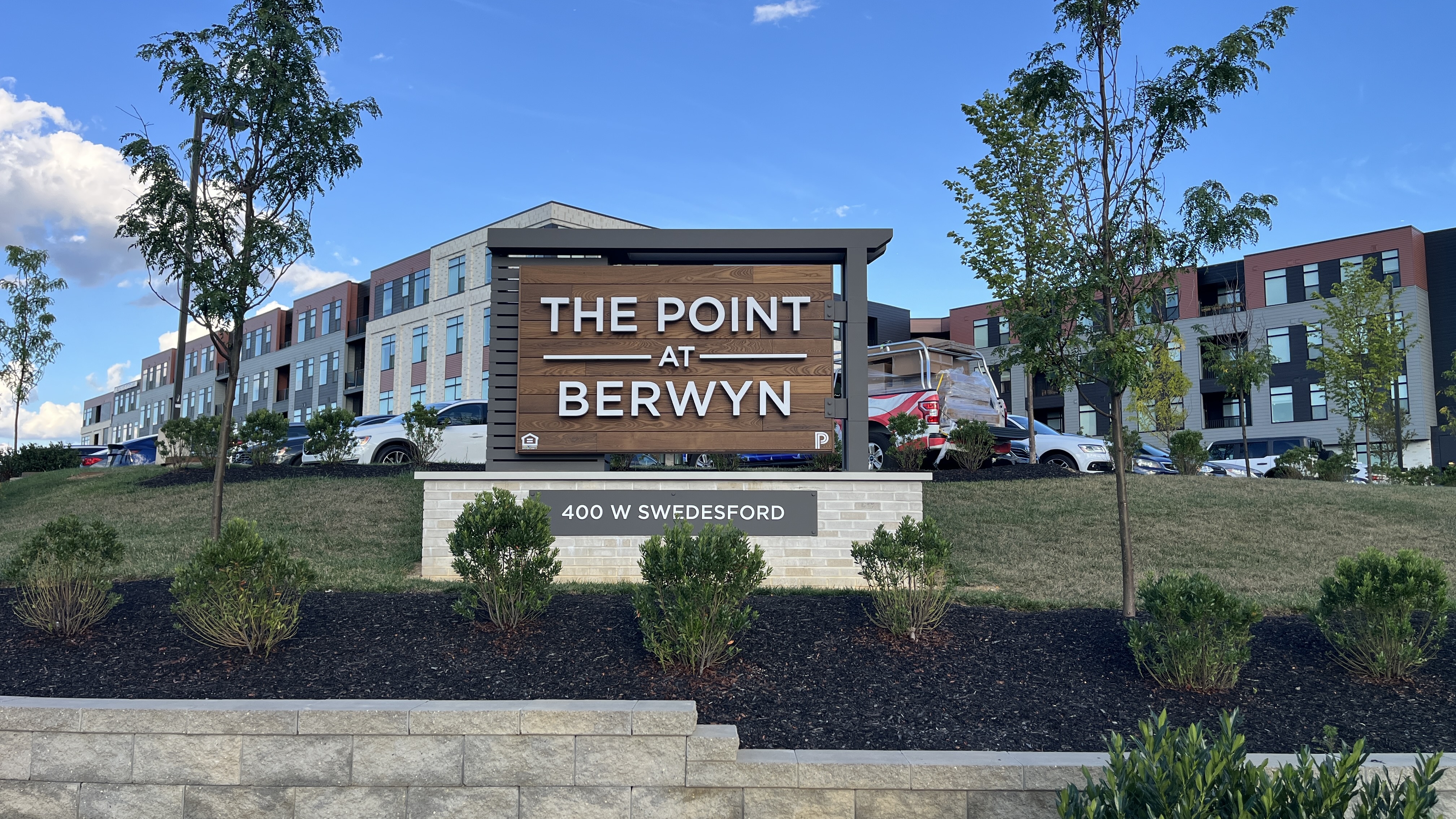 Custom monument sign blending metal and finished wood