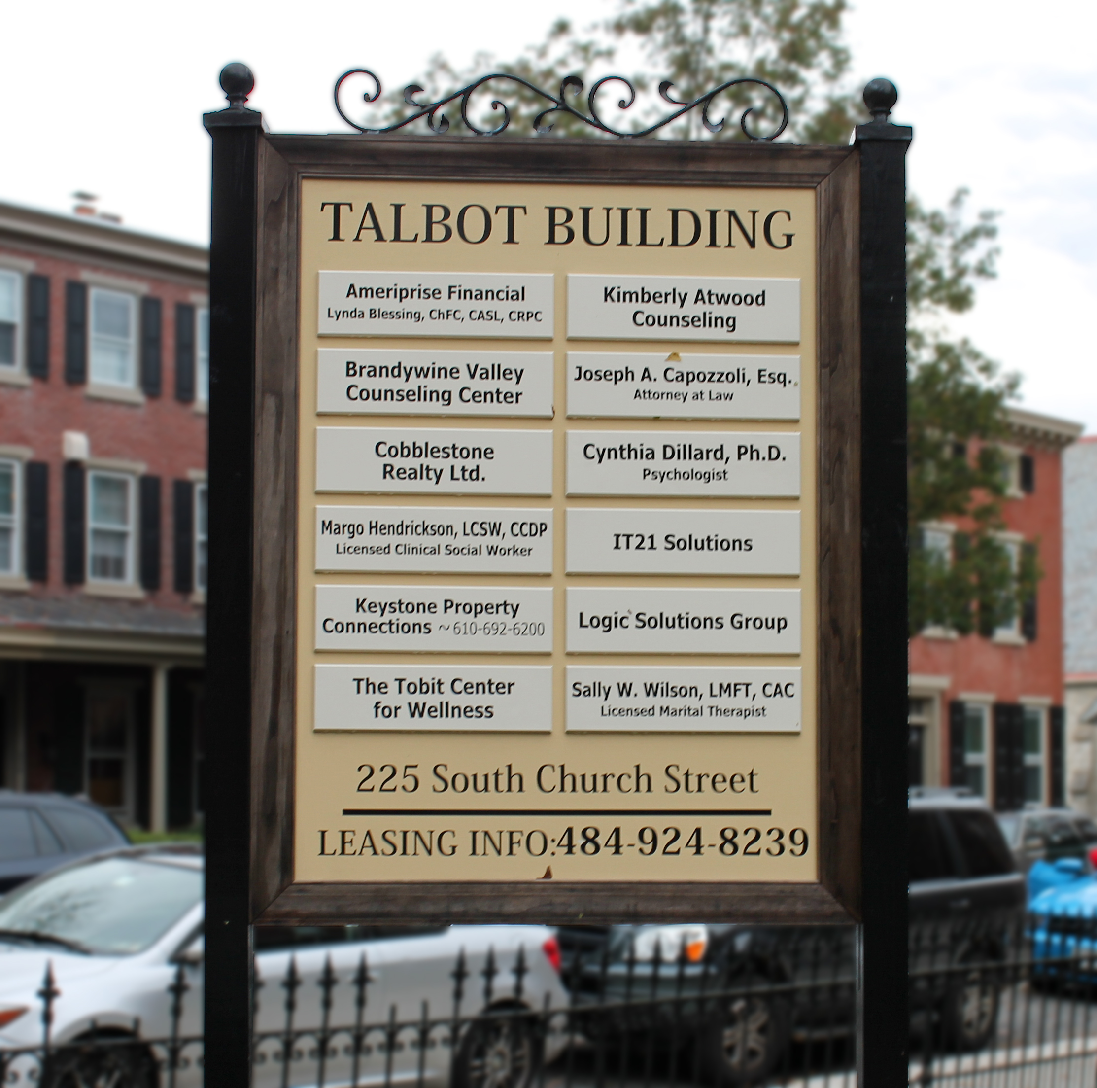 Building directory on exterior post and panel sign