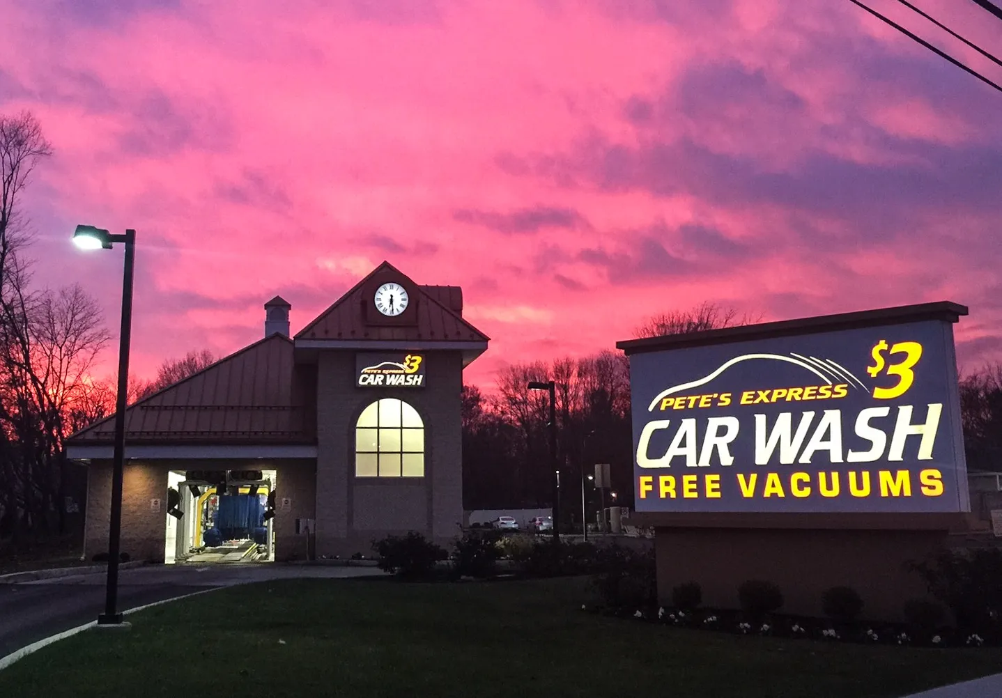 Car wash monument sign at sunset