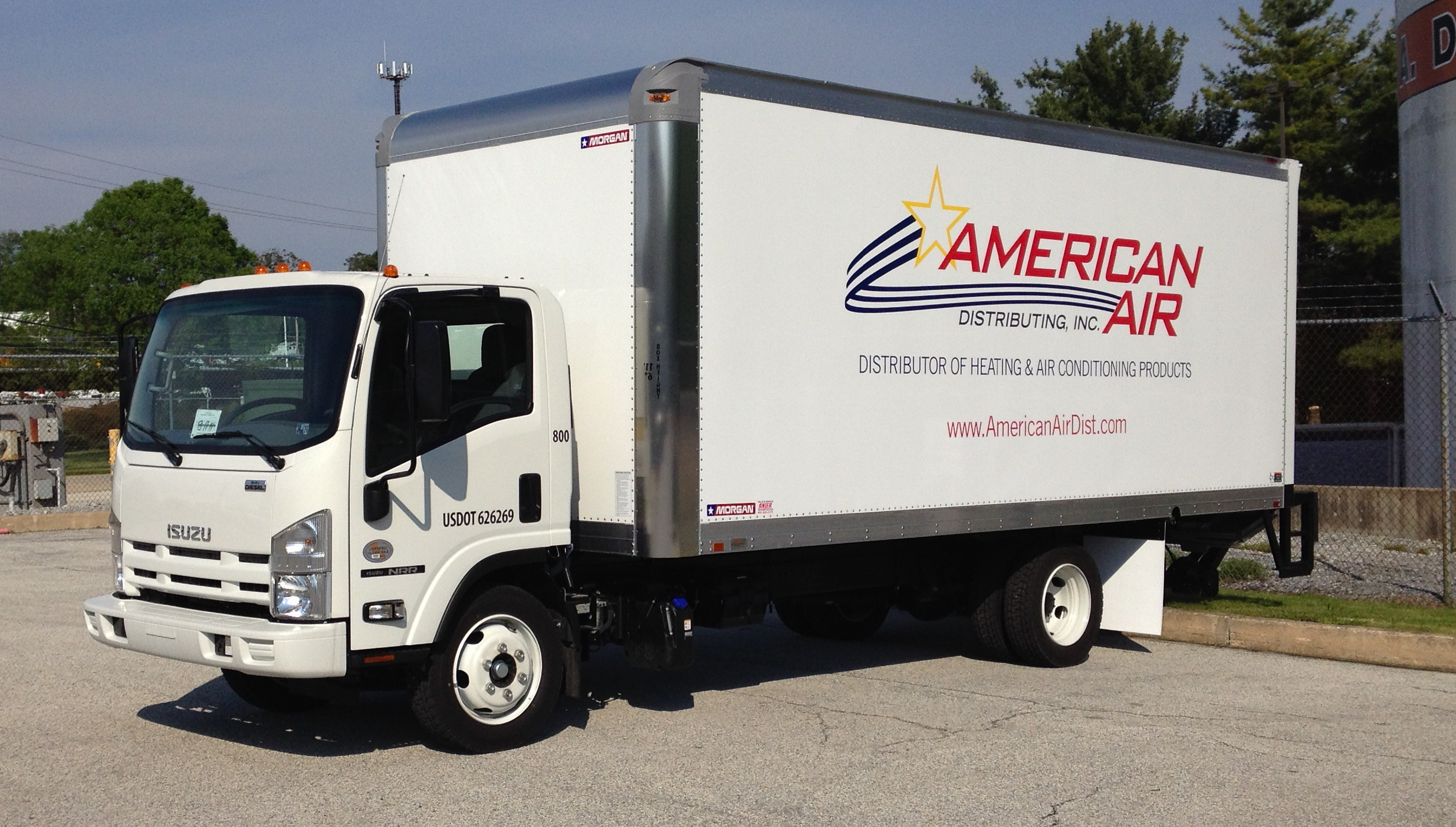 Plotted and weeded vinyl lettering on the side of a box truck