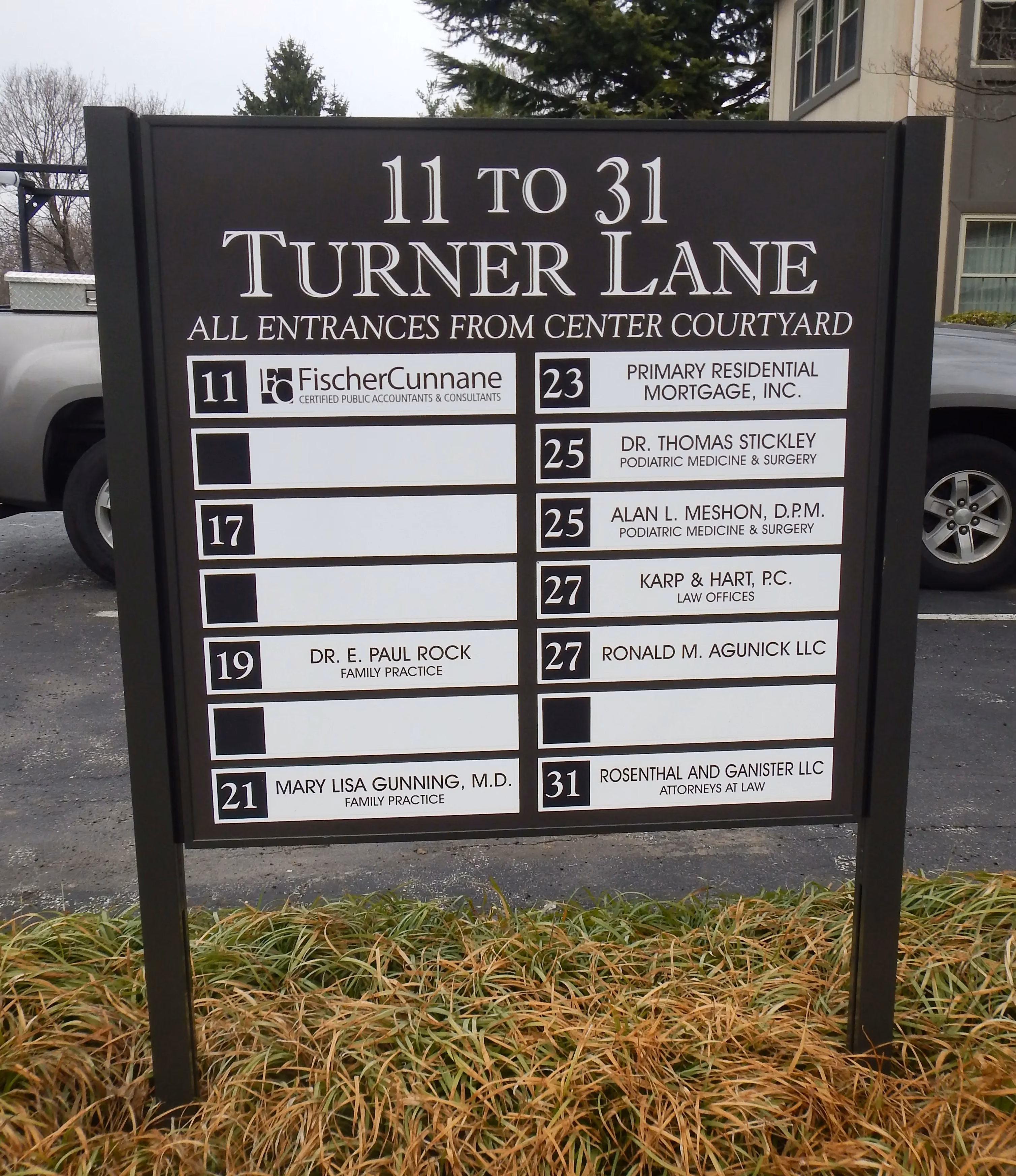 Corporate center directory on a post and panel sign