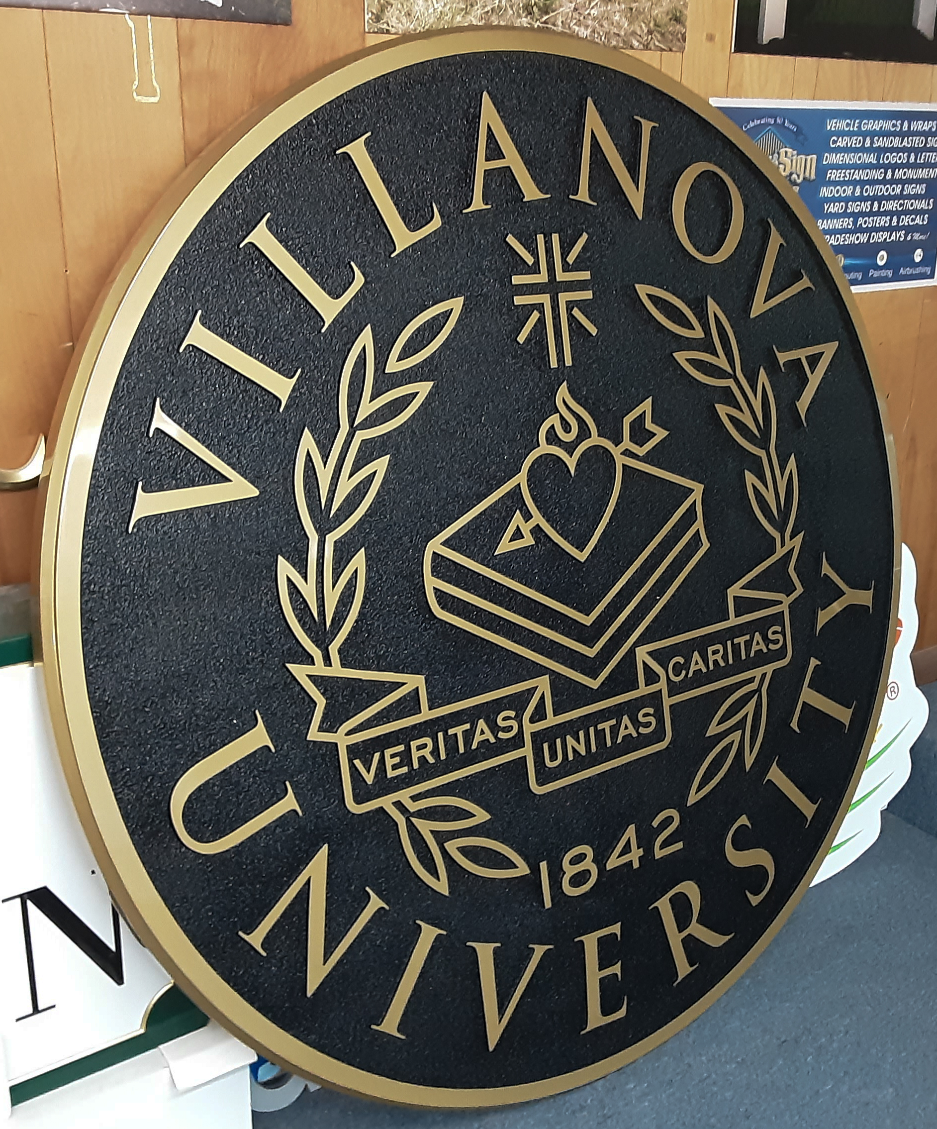 Circular, precision-tooled bronze plaque