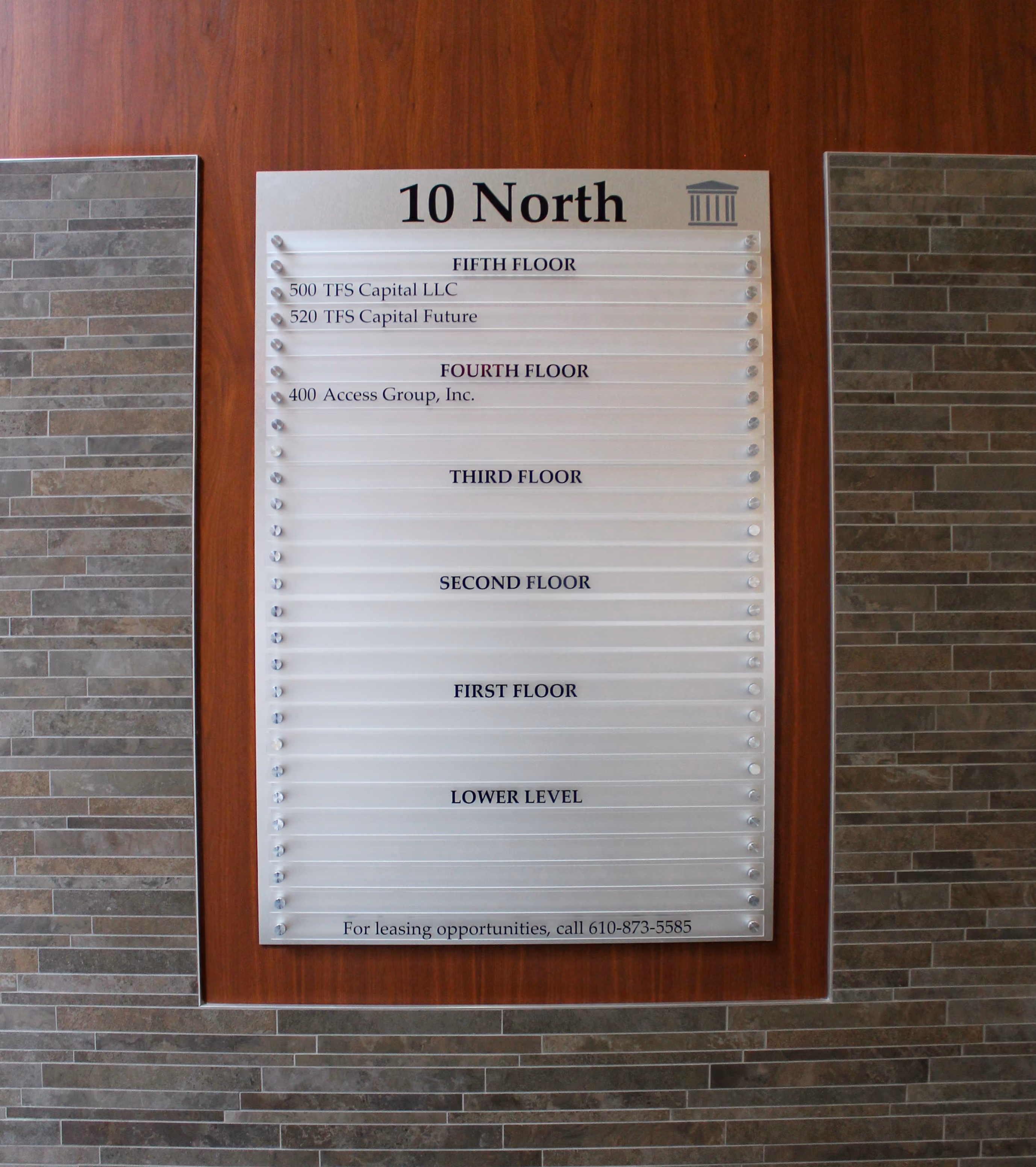 Building directory with each suite on a separate clear acrylic panel