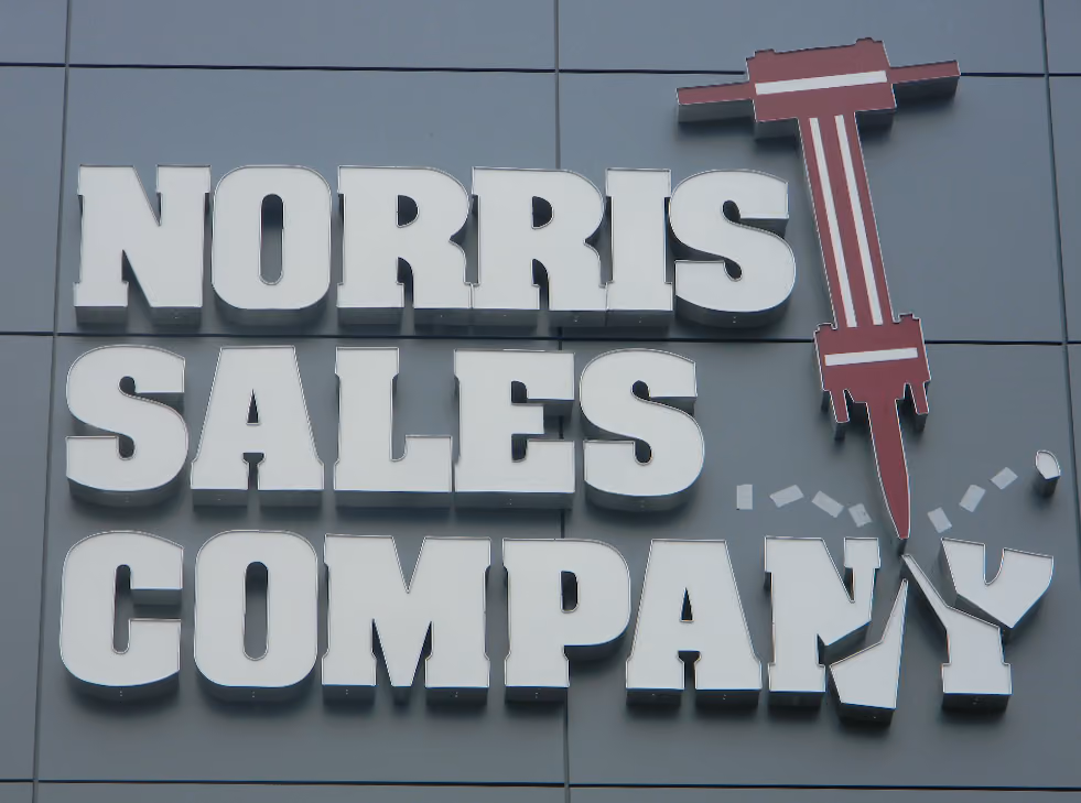White channel letters with large, face-lit logo
