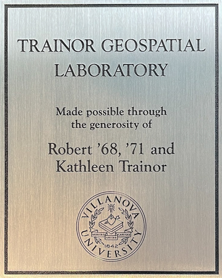 Etched aluminum plaque with lettering and a university seal