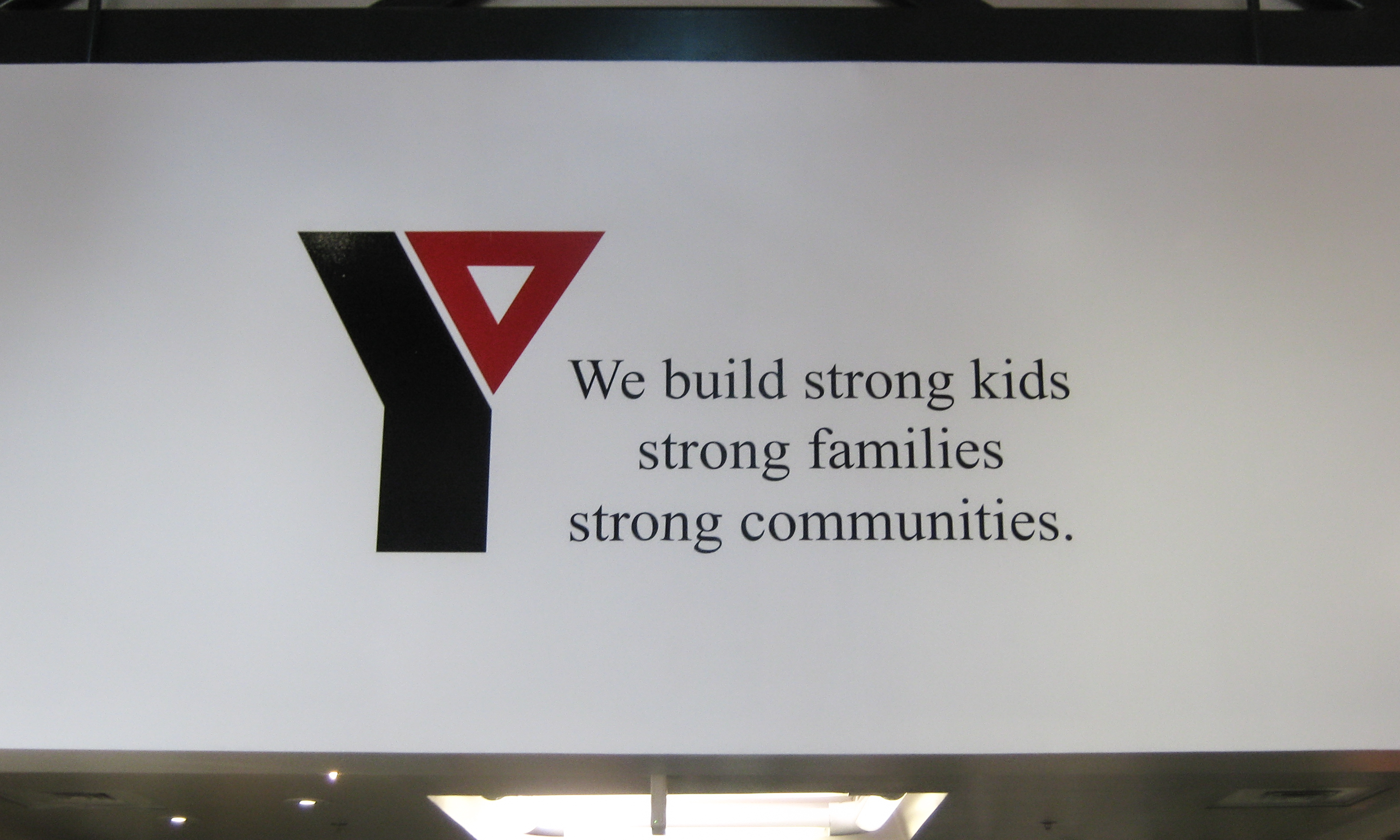 Plotted and weeded vinyl lettering and logo on an interior wall