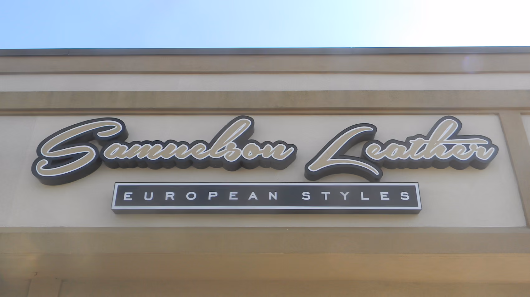 Custom font channel letters above a strip mall storefront