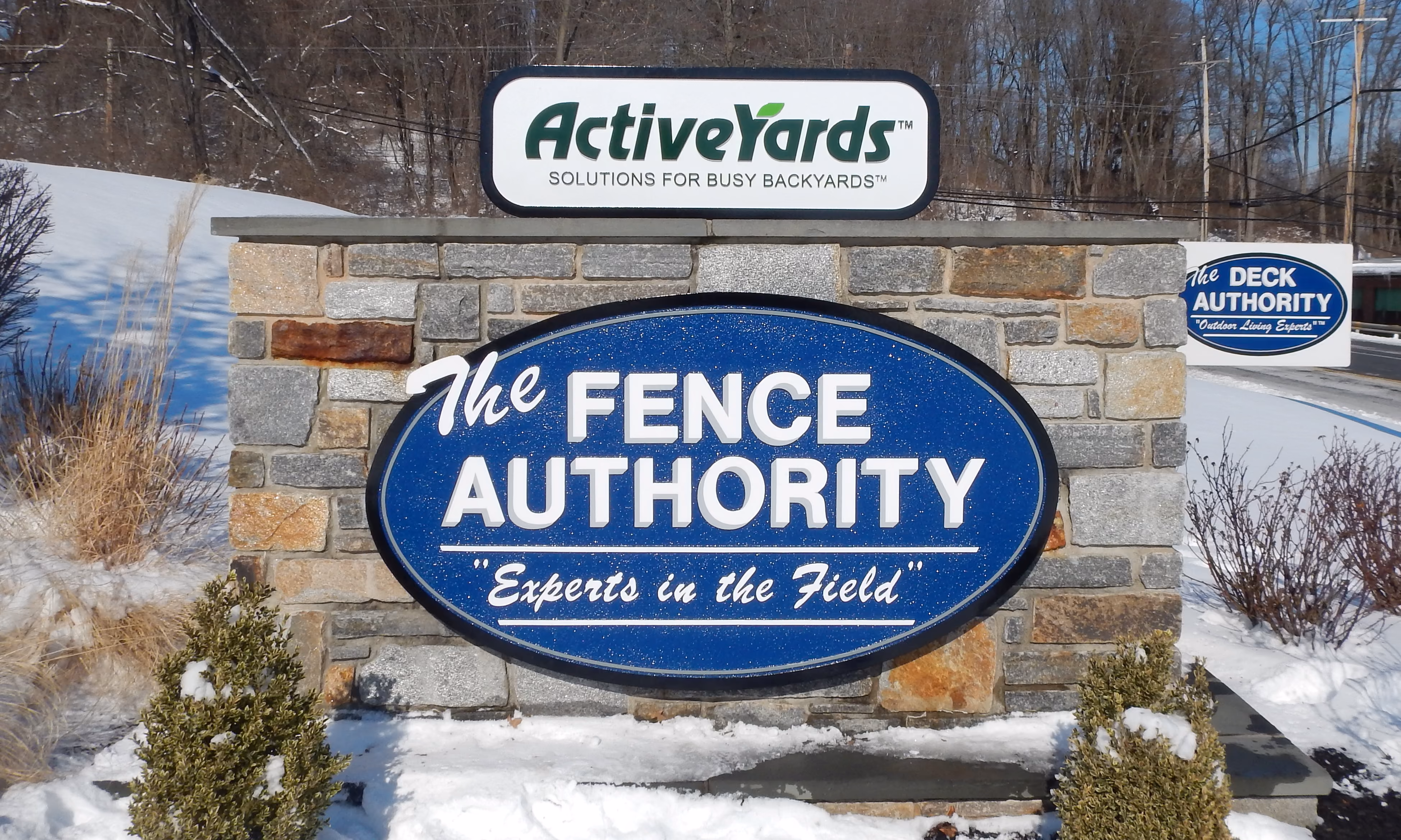 Oval sign face on a natural stone wall